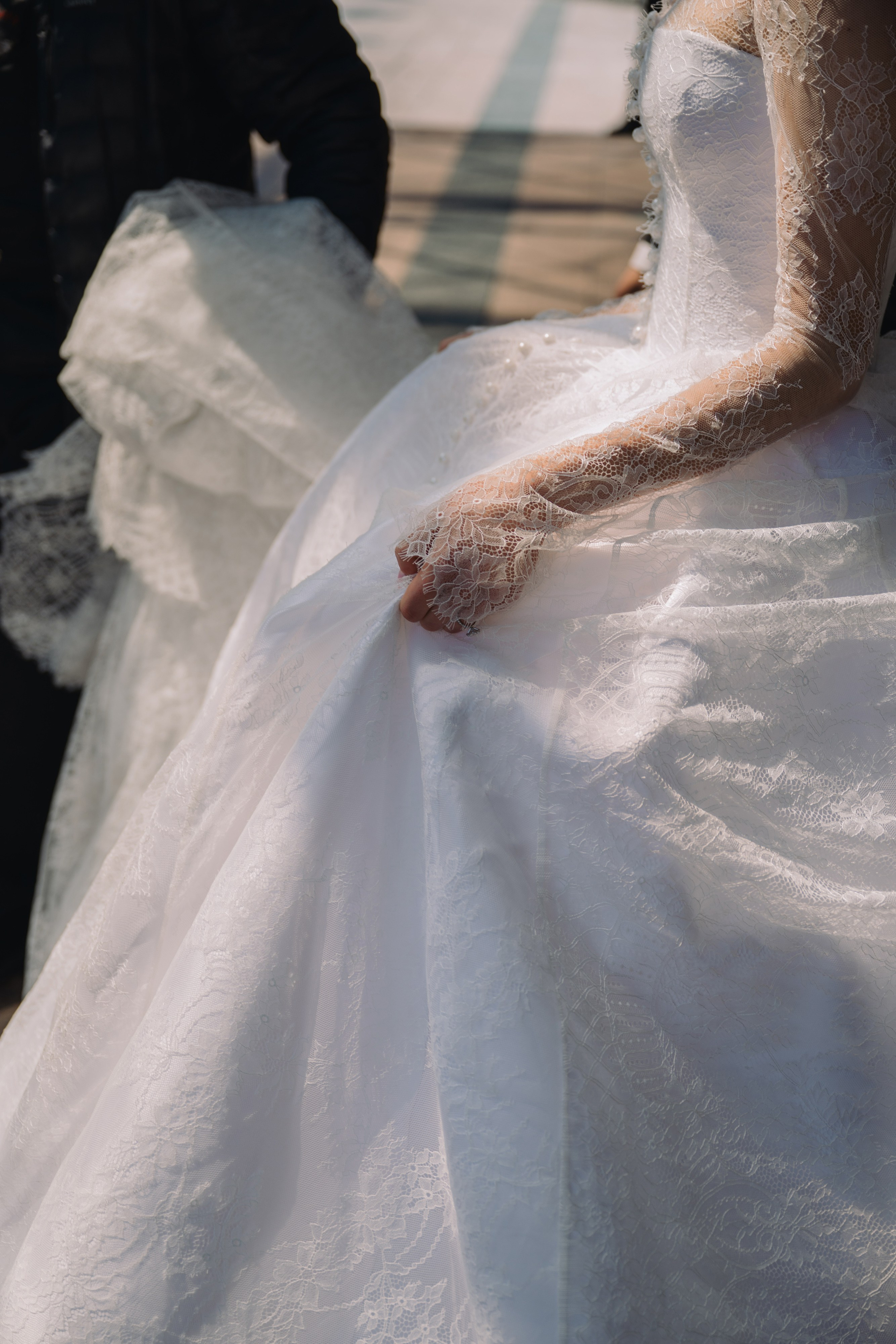 a woman in a wedding dress is walking down the street