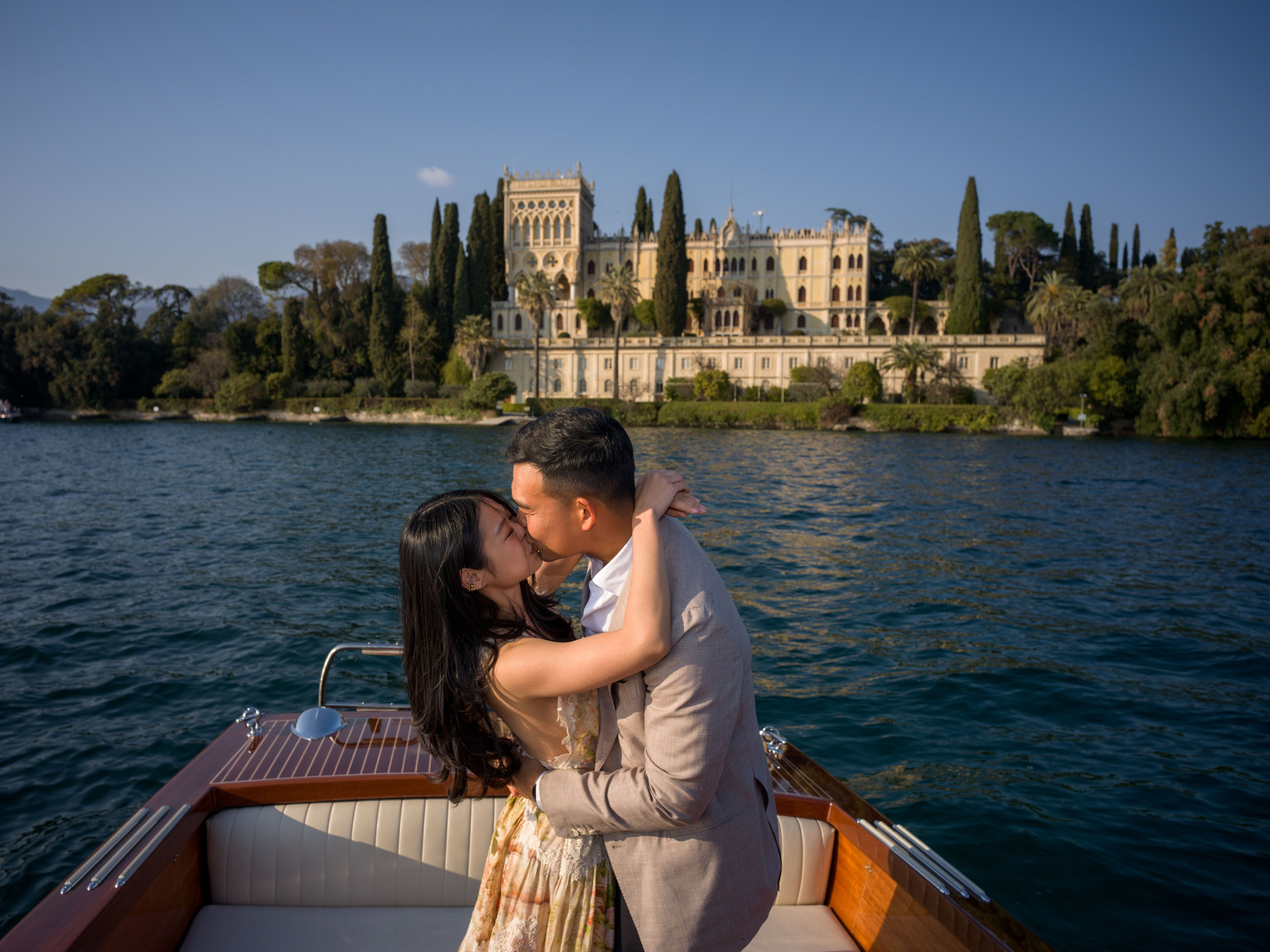 Couple engagement photo with Isola del Garda scenery.
