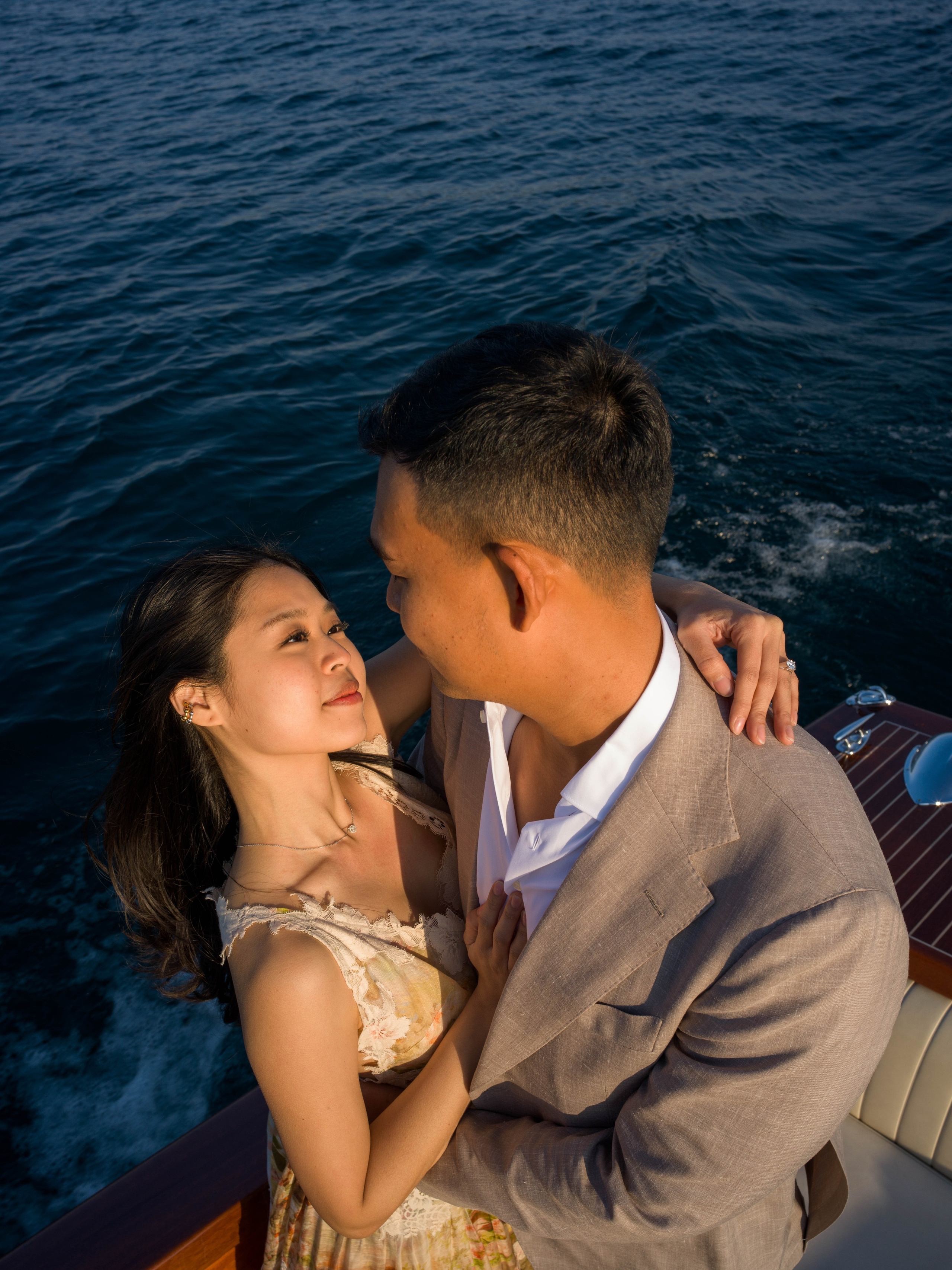 Sunset engagement with Isola del Garda in the background.