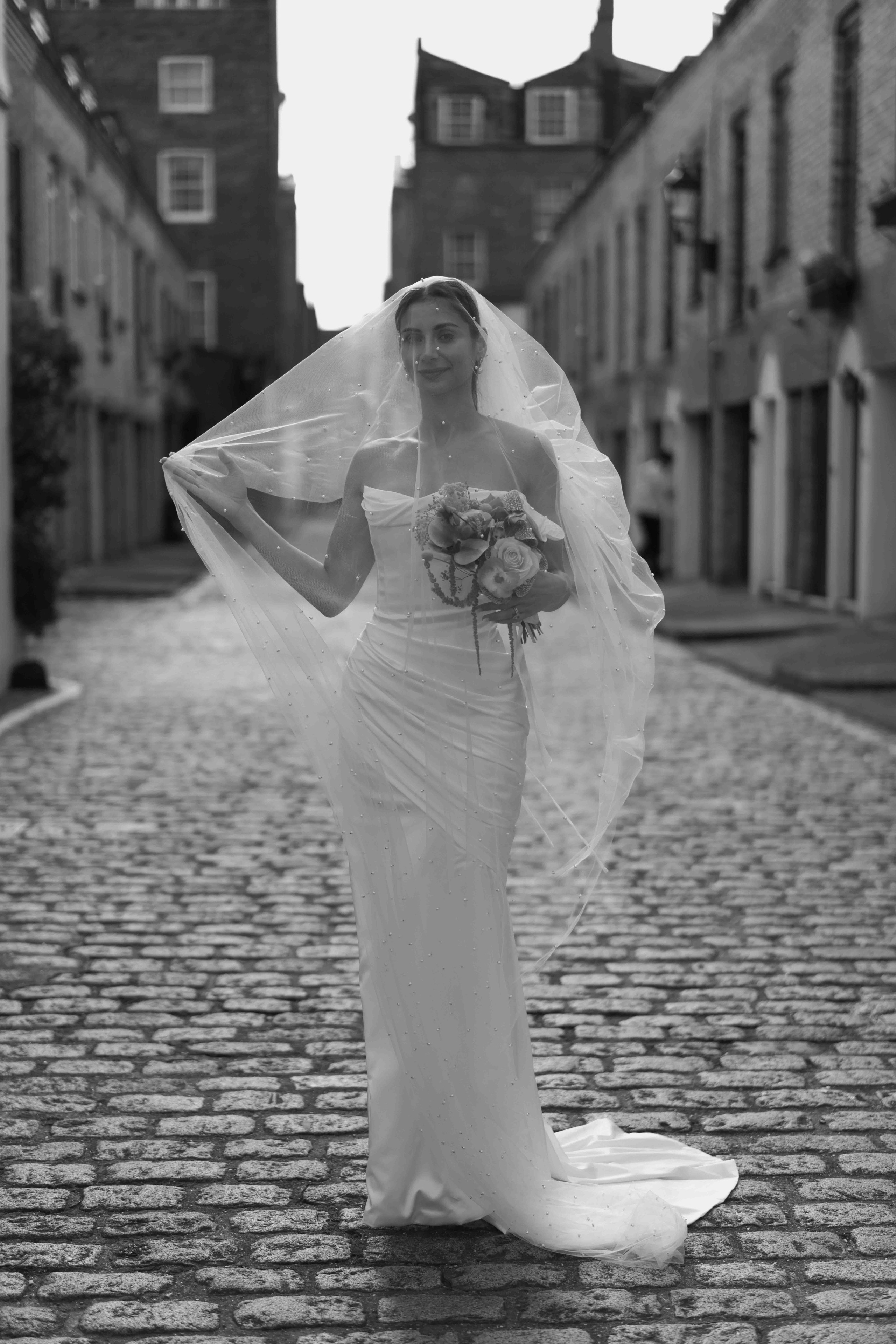 portrait bride with veil London wedding Marylebone Town Hall cinematic elegant moment UK photographer