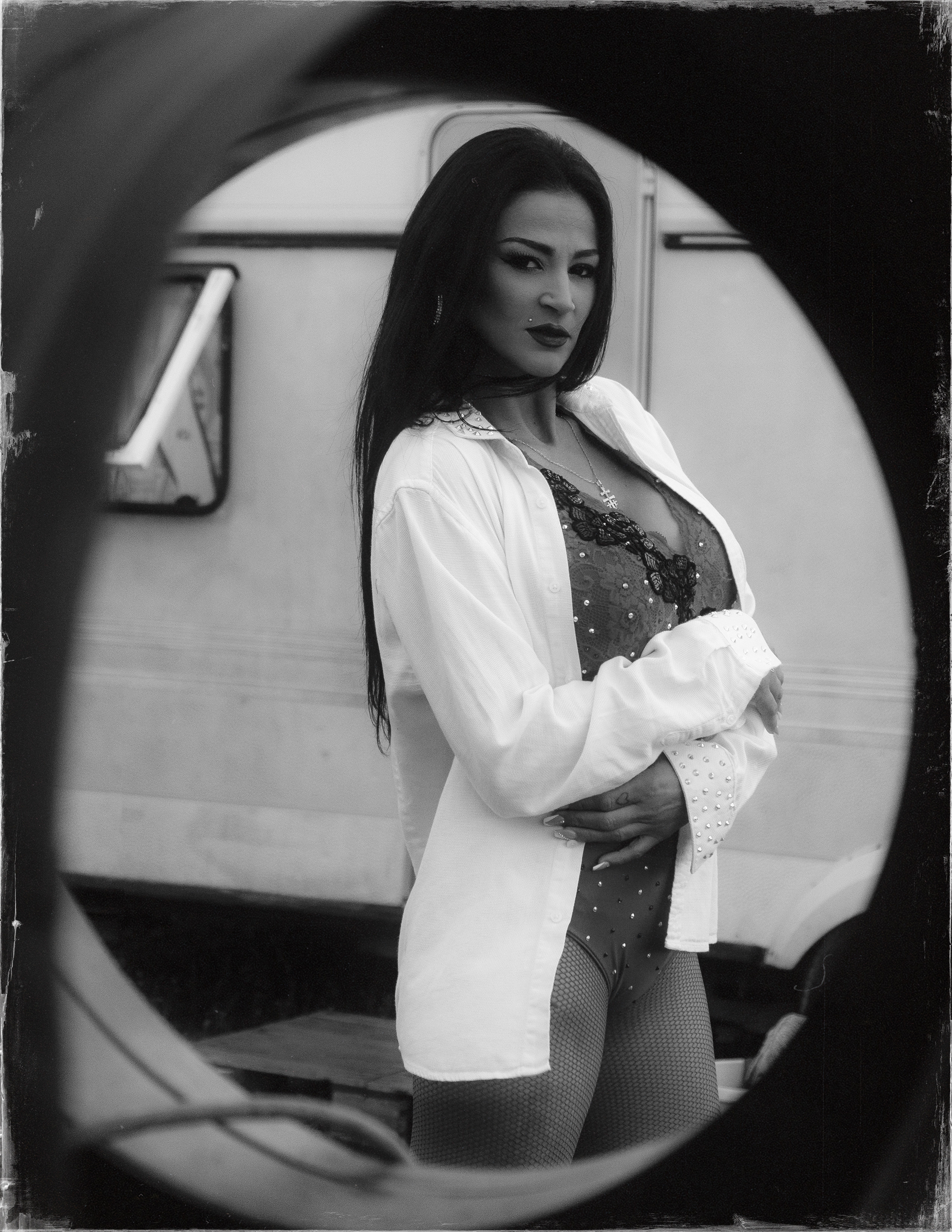 Glamorous photoshoot for a circus performer: motorcycle, fashion and dynamics