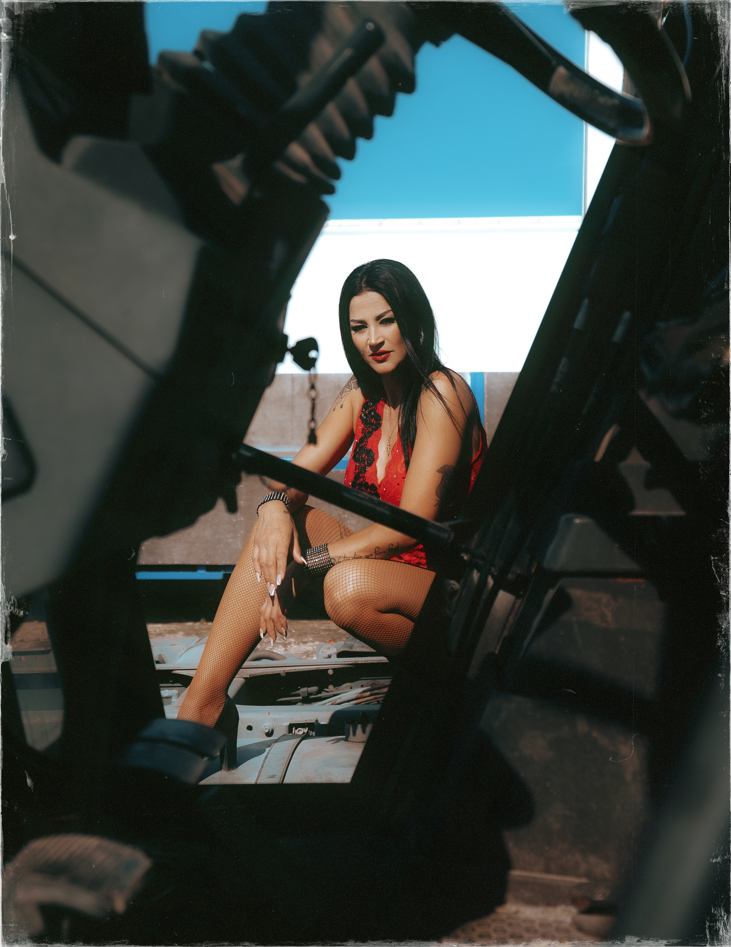 Glamorous photoshoot for a circus performer: motorcycle, fashion and dynamics