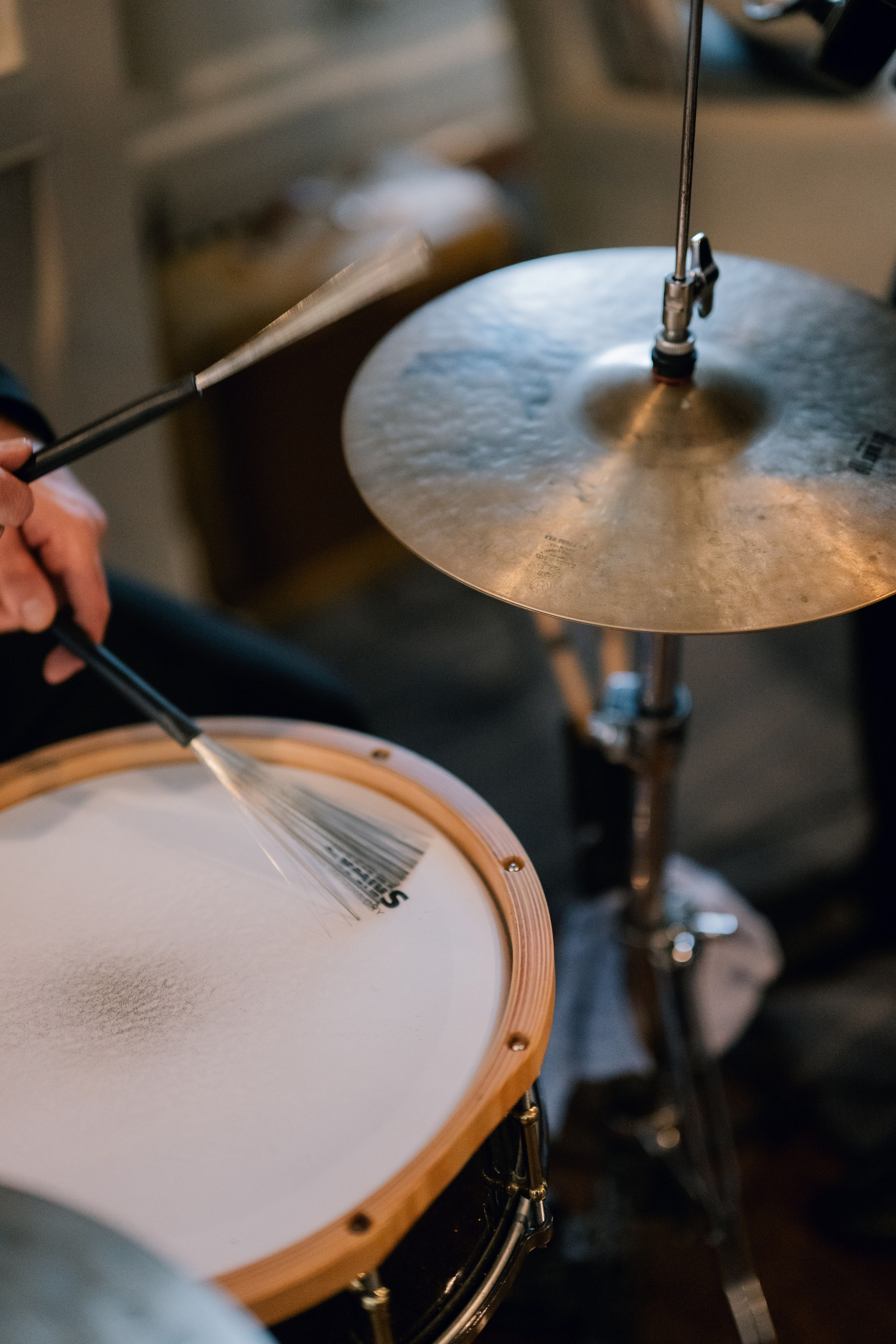 a person playing a drum on a stage