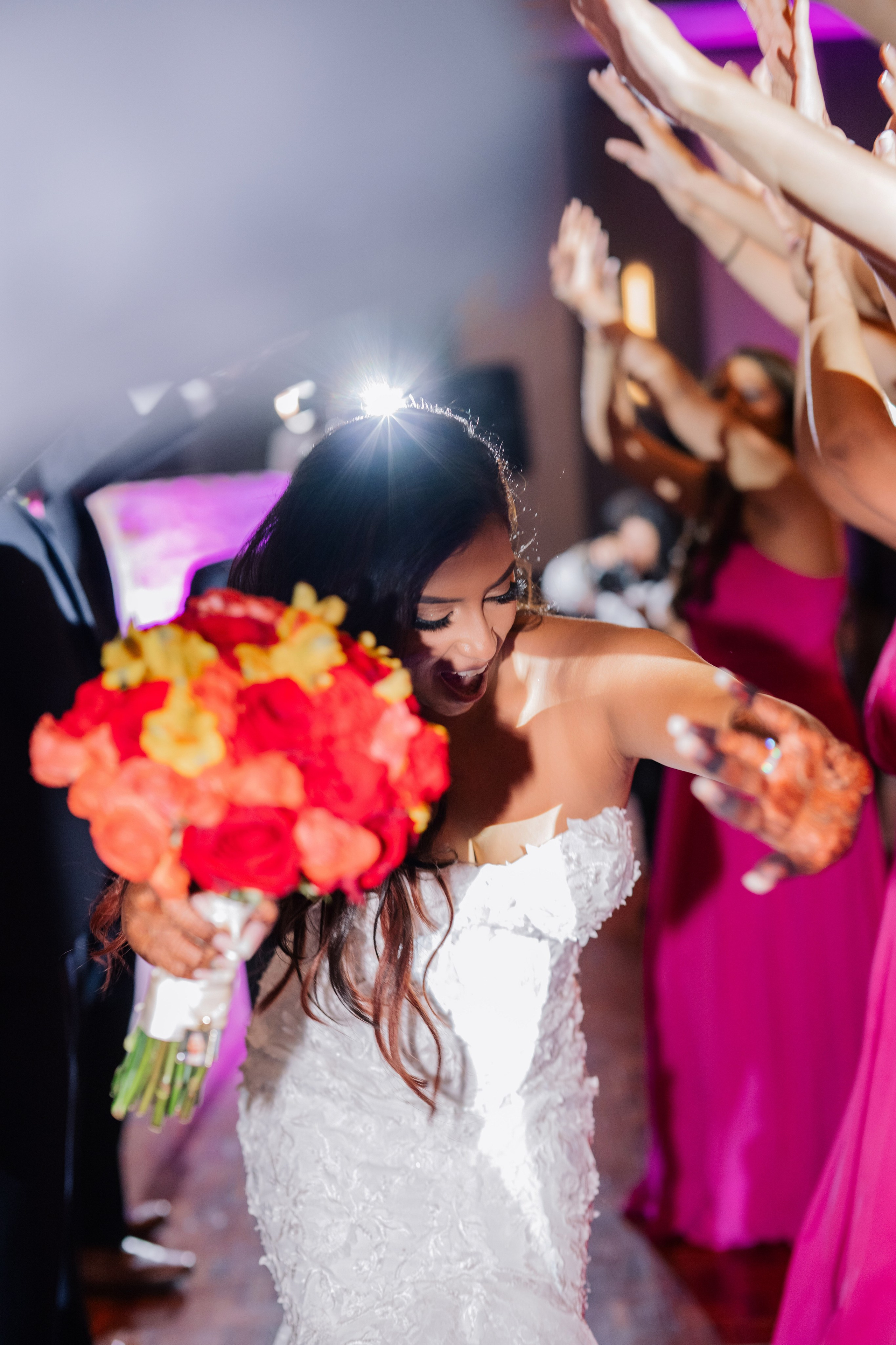 a bride is holding a bouquet of flowers