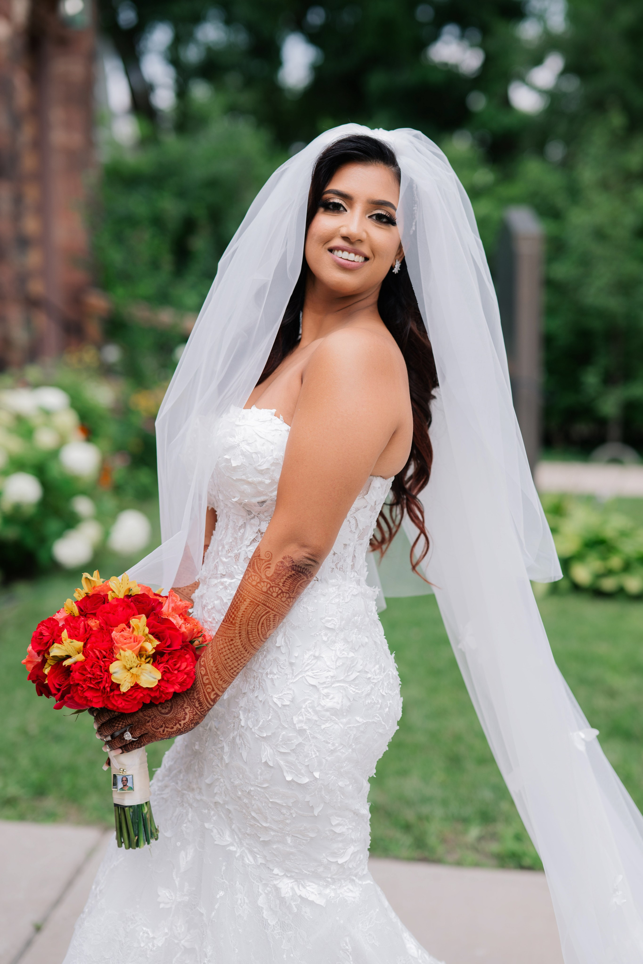 a bride in a wedding dress holding a bouquet