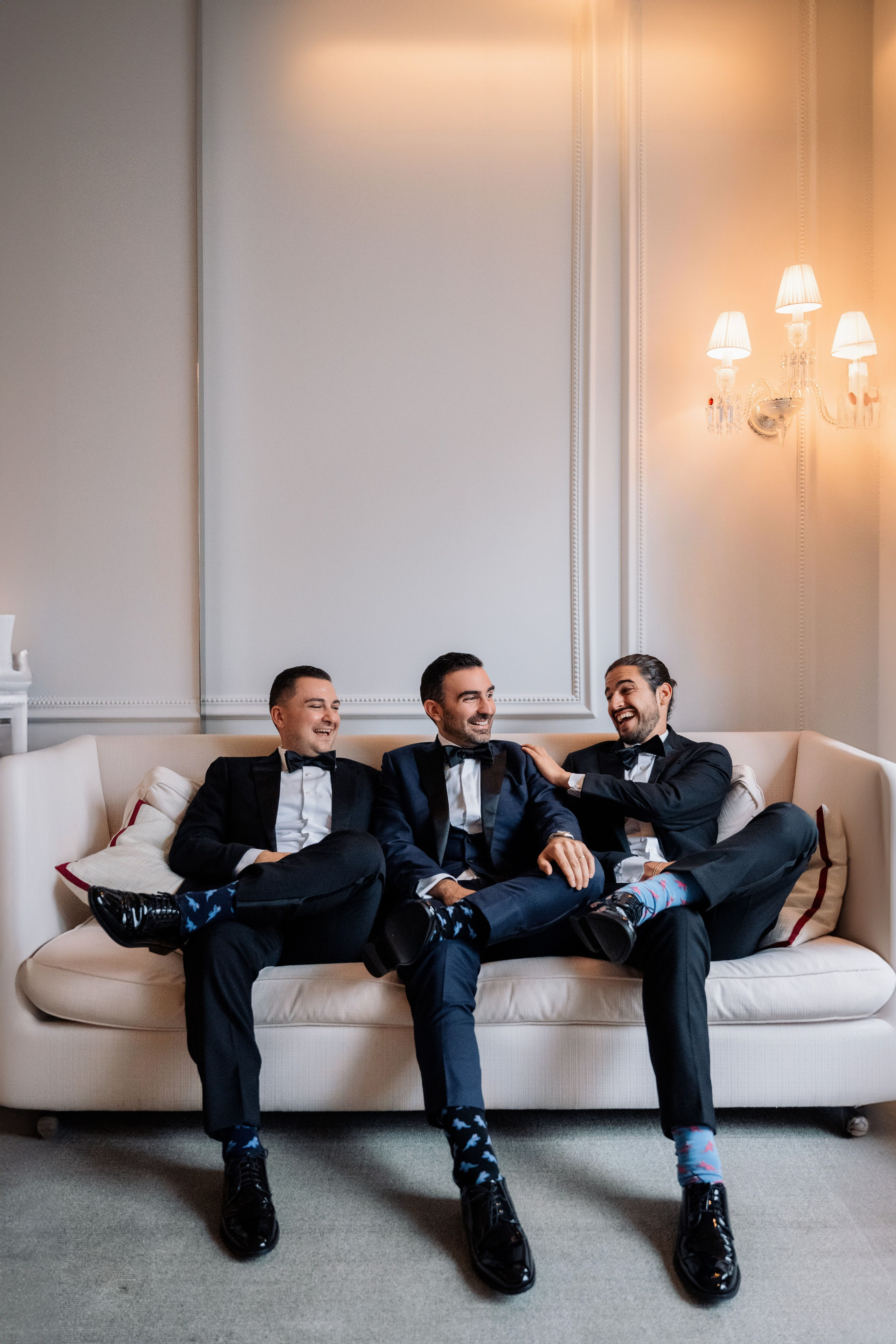 two men sitting on a couch