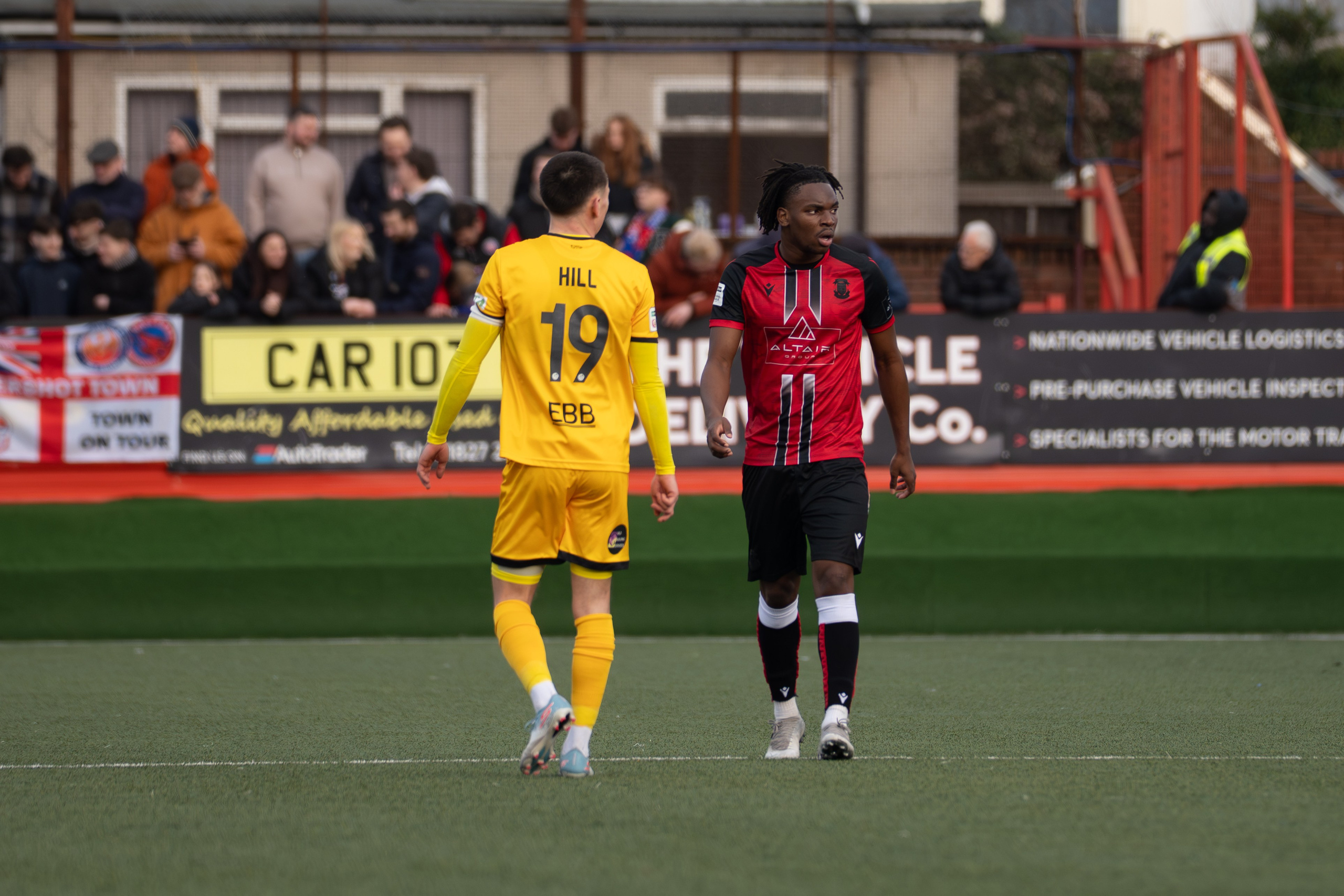 Tamworth, England — February 14, 2026: Tamworth’s Daniel Isichei and Aldershot Town’s Ryan Hill during the Enterprise National League match between Tamworth and Aldershot Town at The Lamb Ground. Photo: Jay Soundo