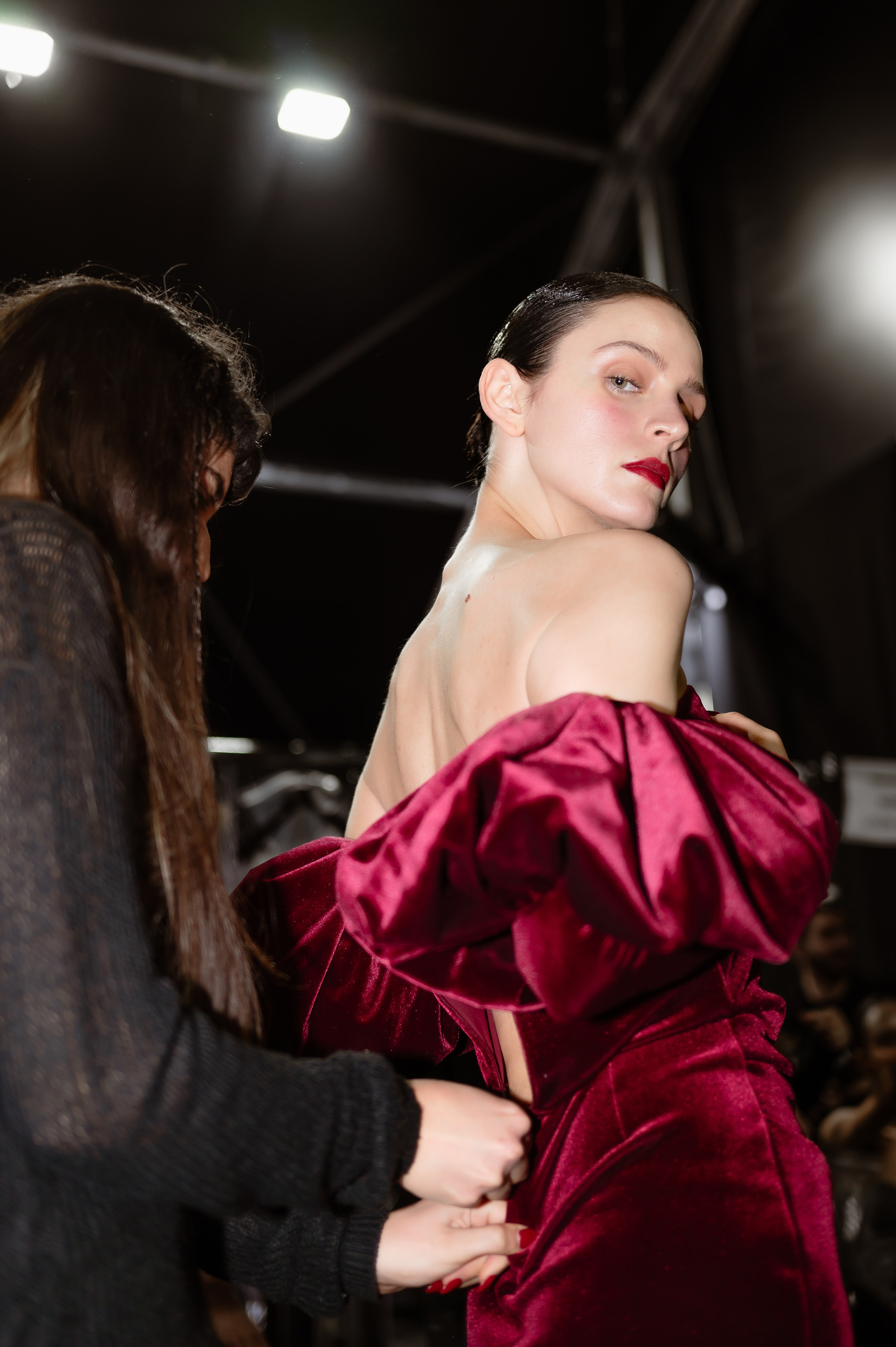 Behind-the-scenes photo of model preparation before runway