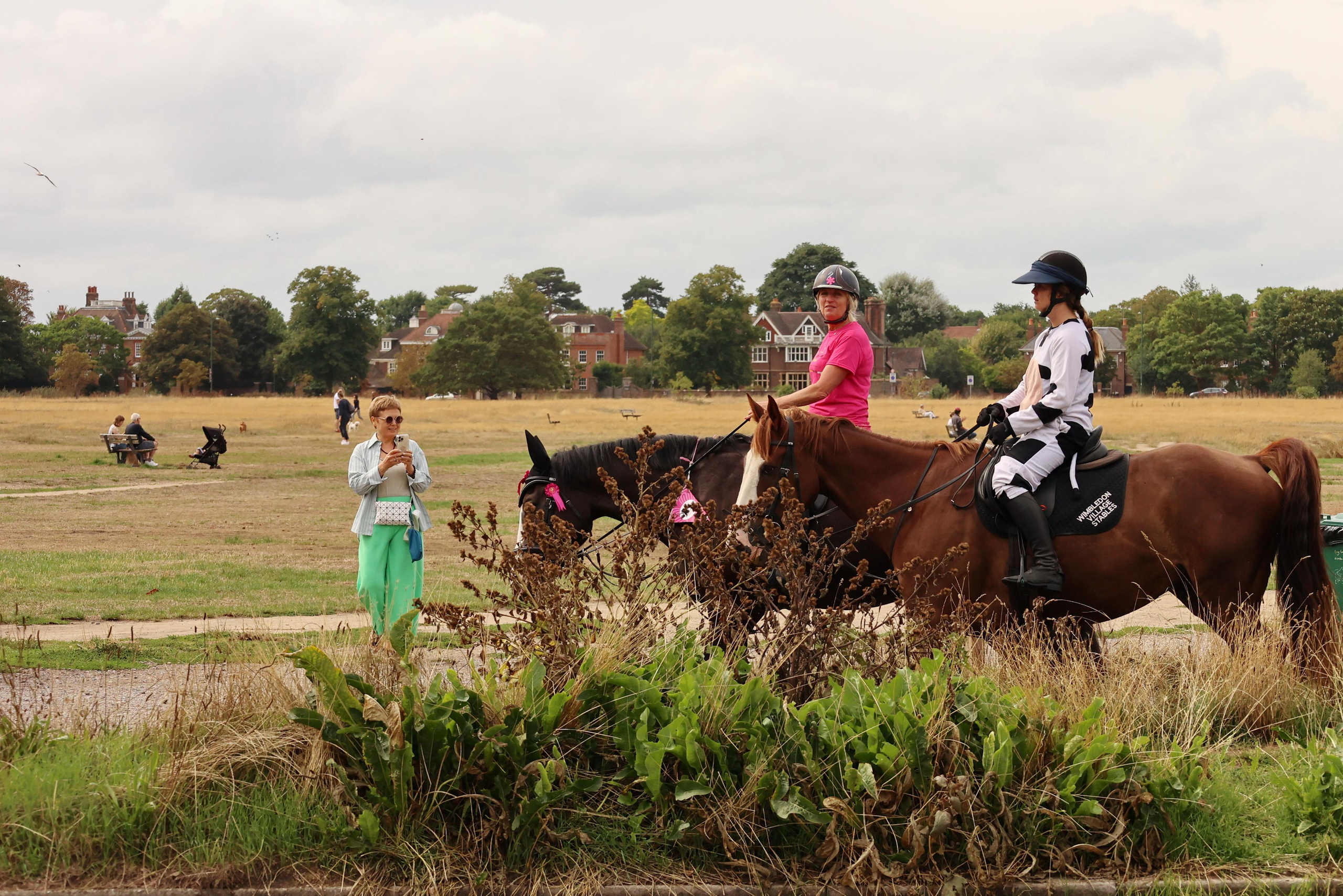 Charity ride Wimbledon Stables. Couples and portraits photographer Wimbledon London