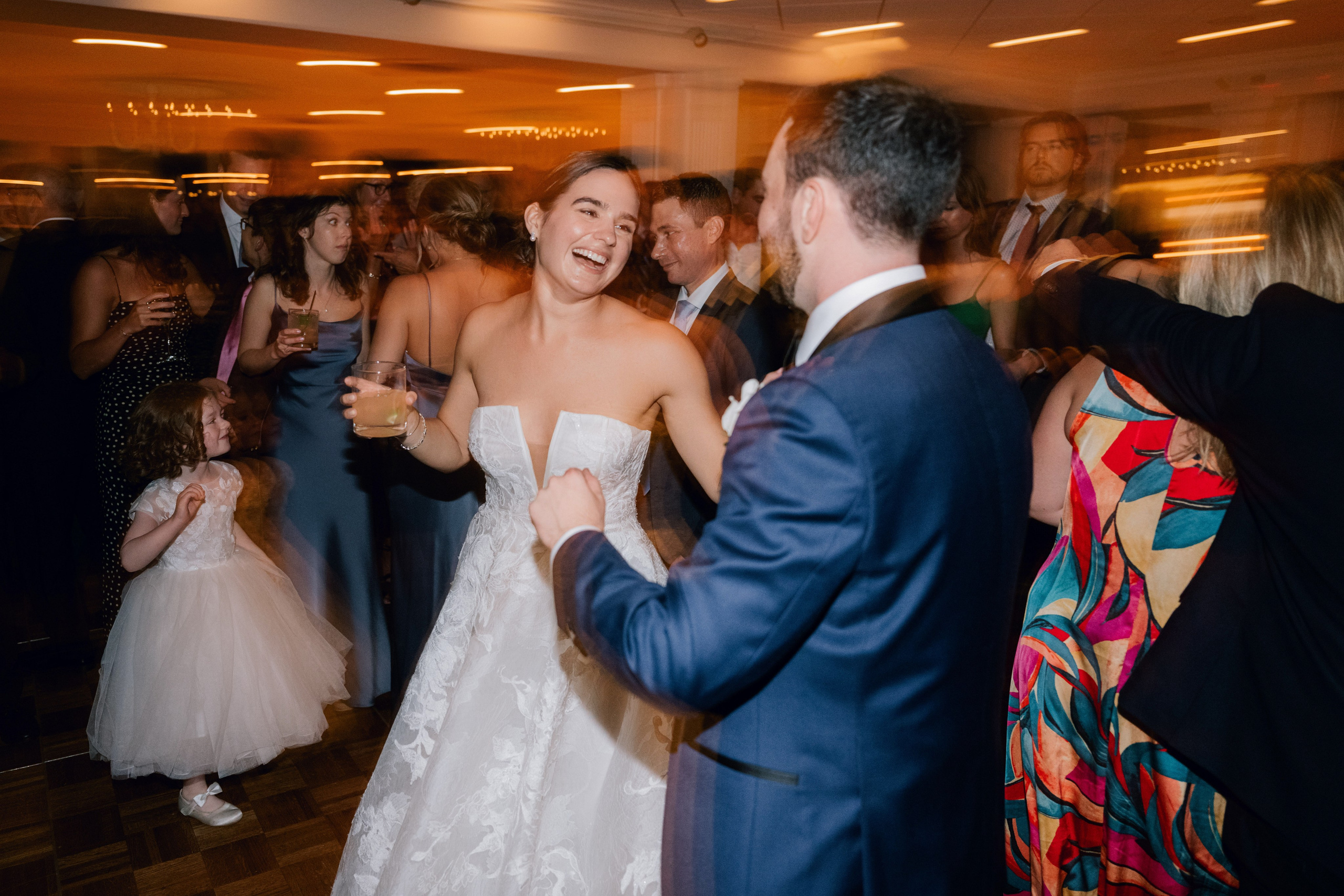 a bride and groom dancing at a wedding reception