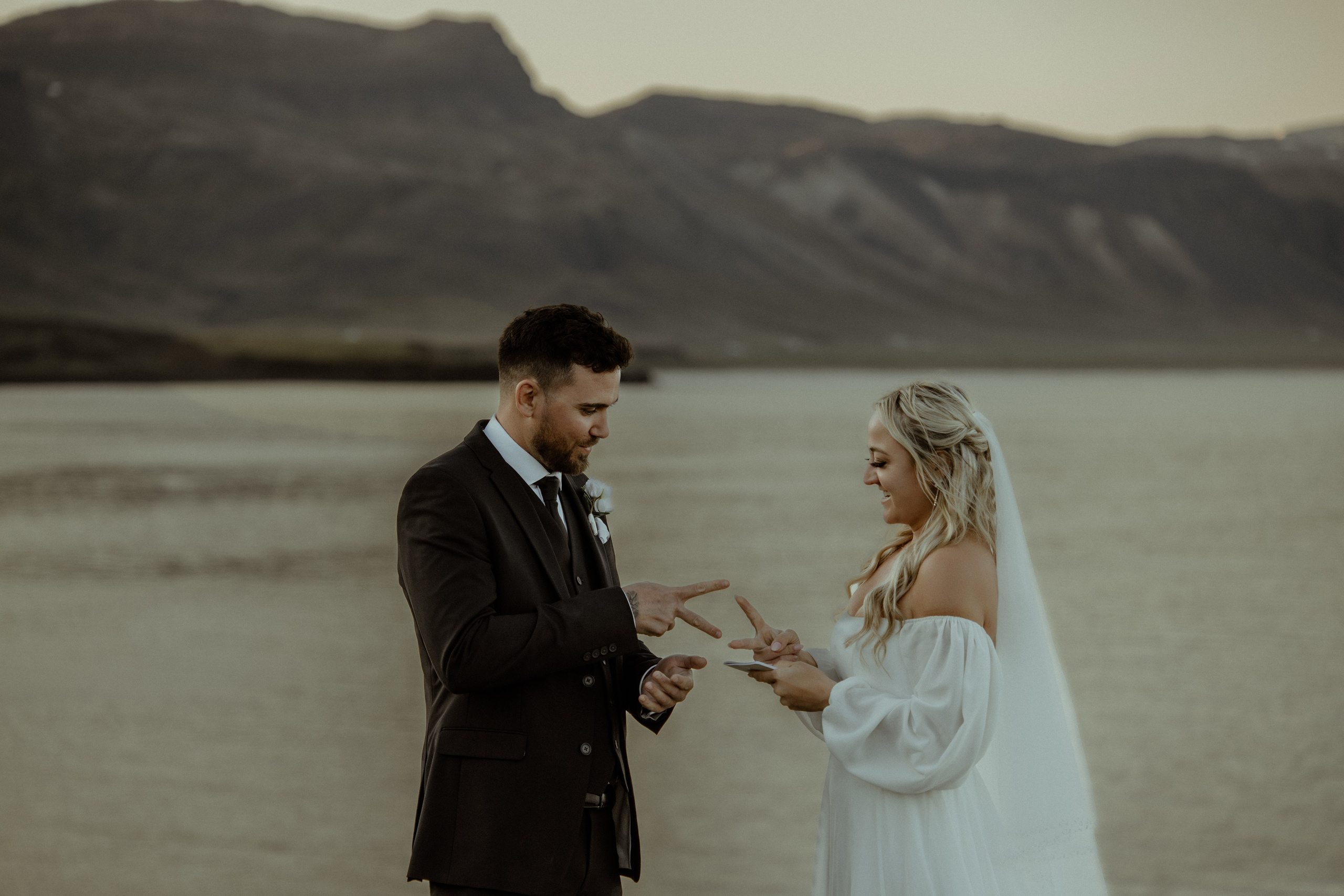 Iceland elopement at Budir with midnight sun wedding photos at black sand beach. Iceland elopement photographer & videographer