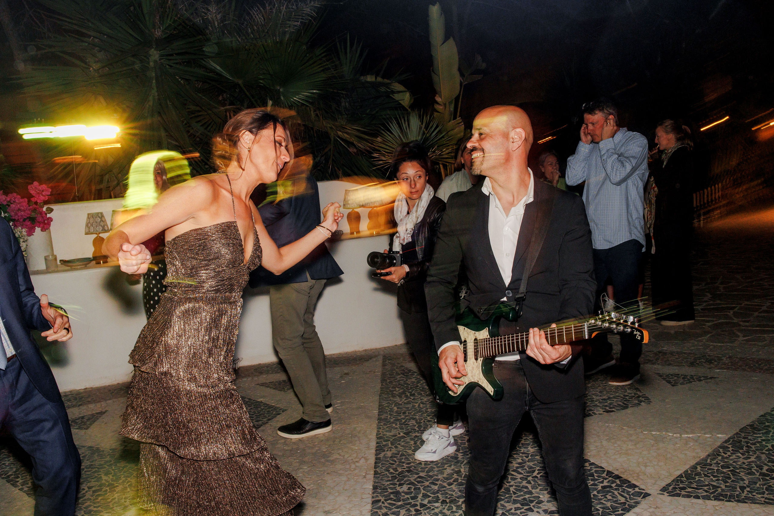 Guests celebrating at a lively wedding reception in Barcelona
