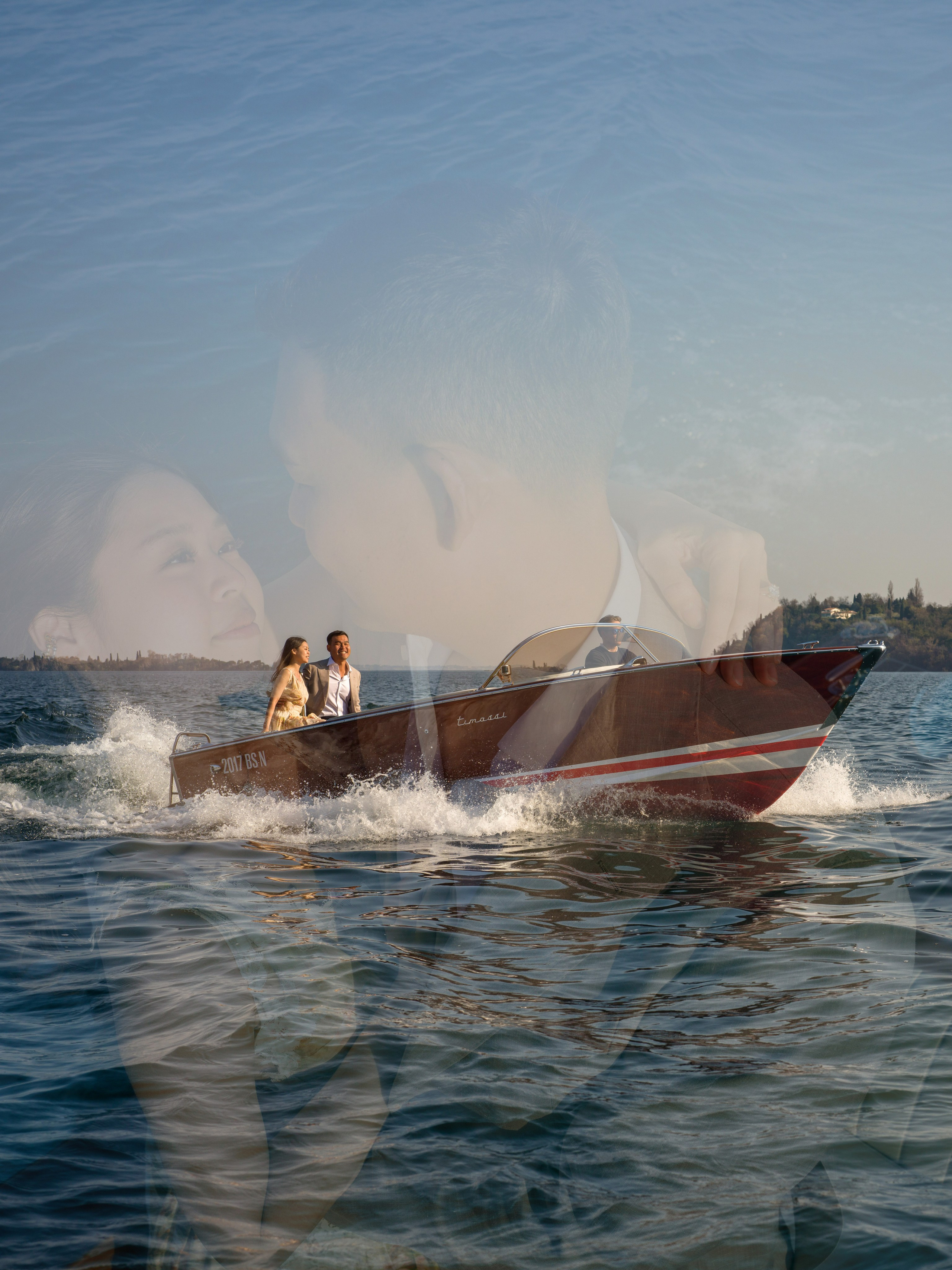 Sunset proposal at Lake Garda with Isola del Garda behind the couple.