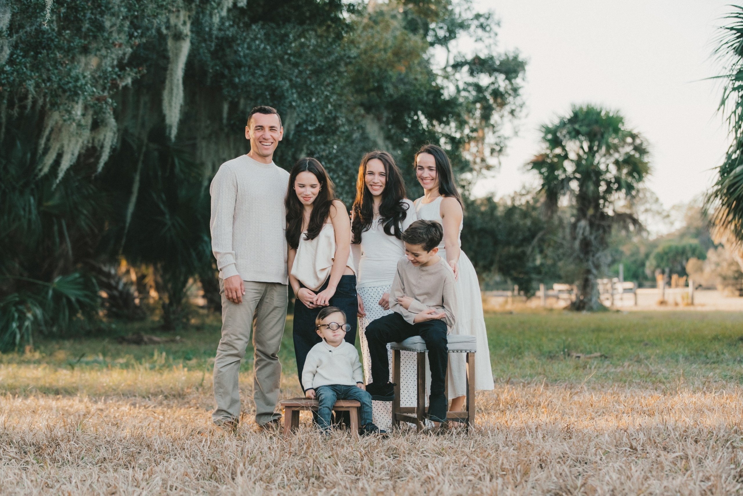 Family of six in a golden field at Walt Range, North Port Florida, lifestyle family photography.