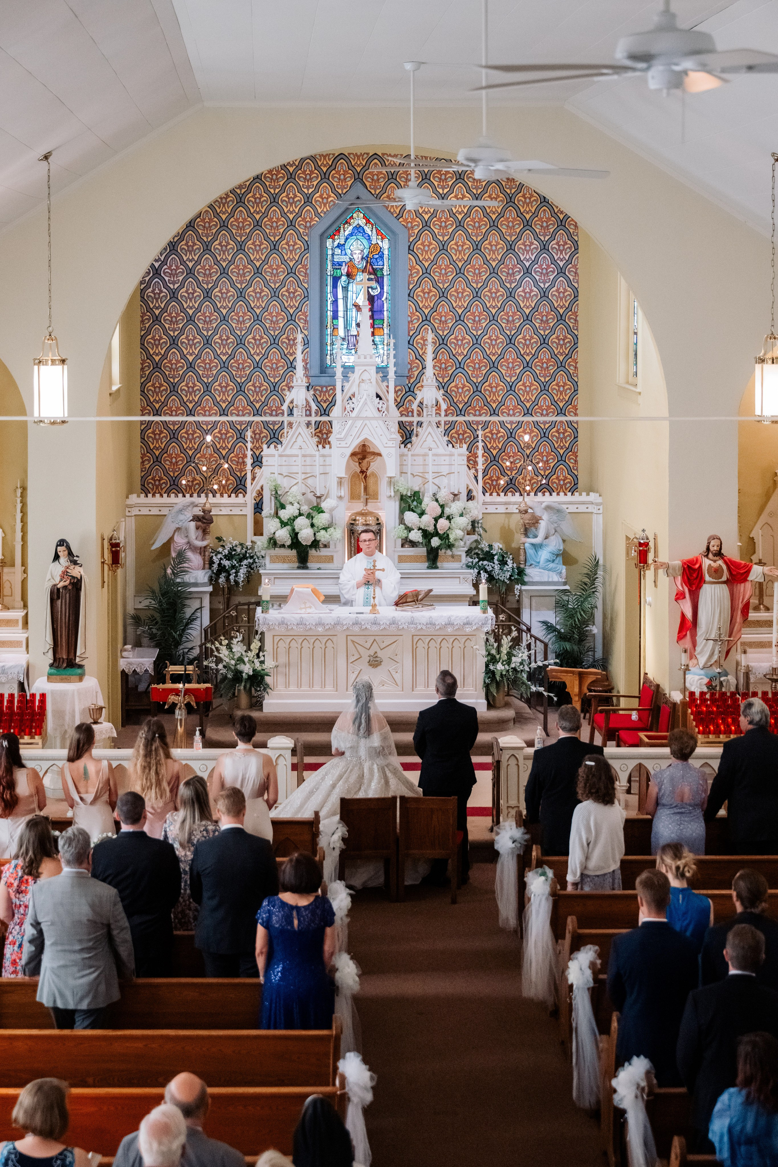 a church with a couple sitting on the pew
