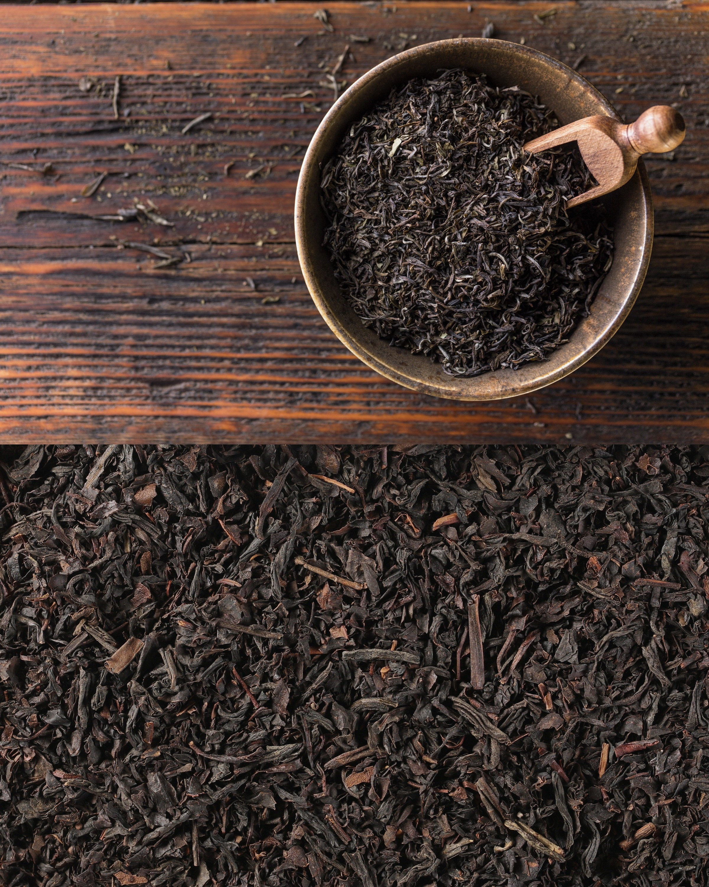 Close-up of black tea leaves with a small scoop resting in a ceramic bowl on a wooden table.