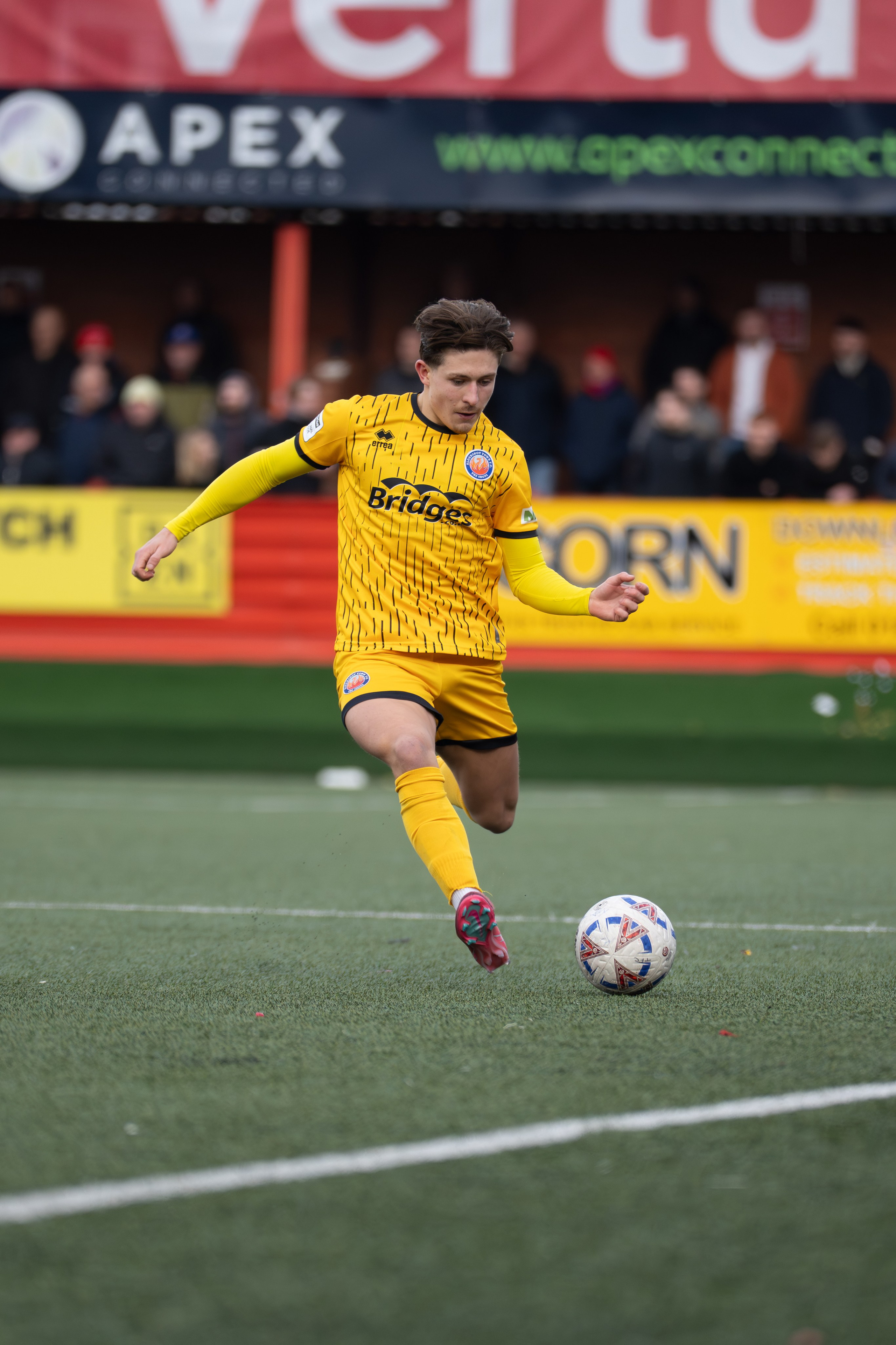 Tamworth, England — February 14, 2026: An Aldershot Town player controls the ball during the Enterprise National League match between Tamworth and Aldershot Town at The Lamb Ground. Photo: Jay Soundo