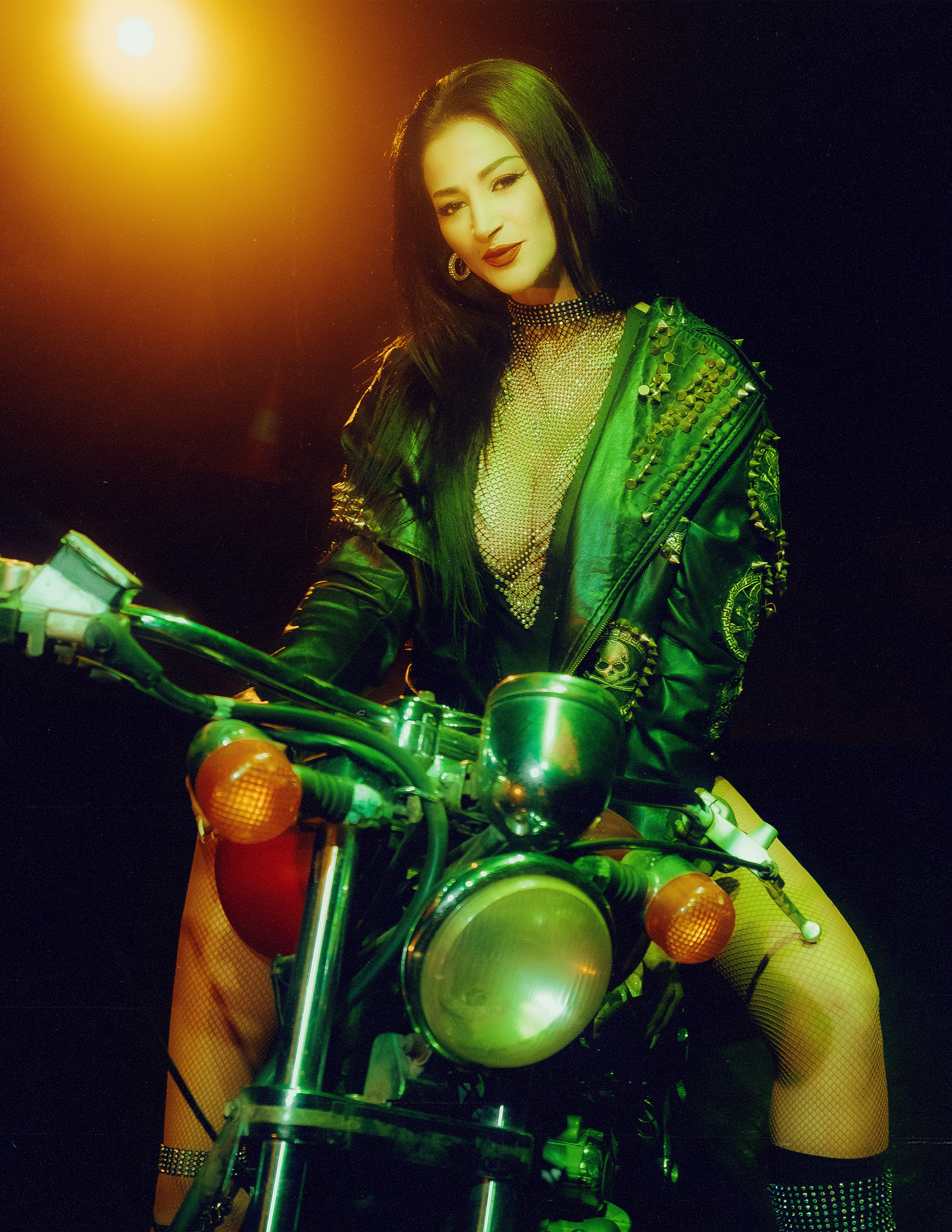 Glamorous photoshoot for a circus performer: motorcycle, fashion and dynamics