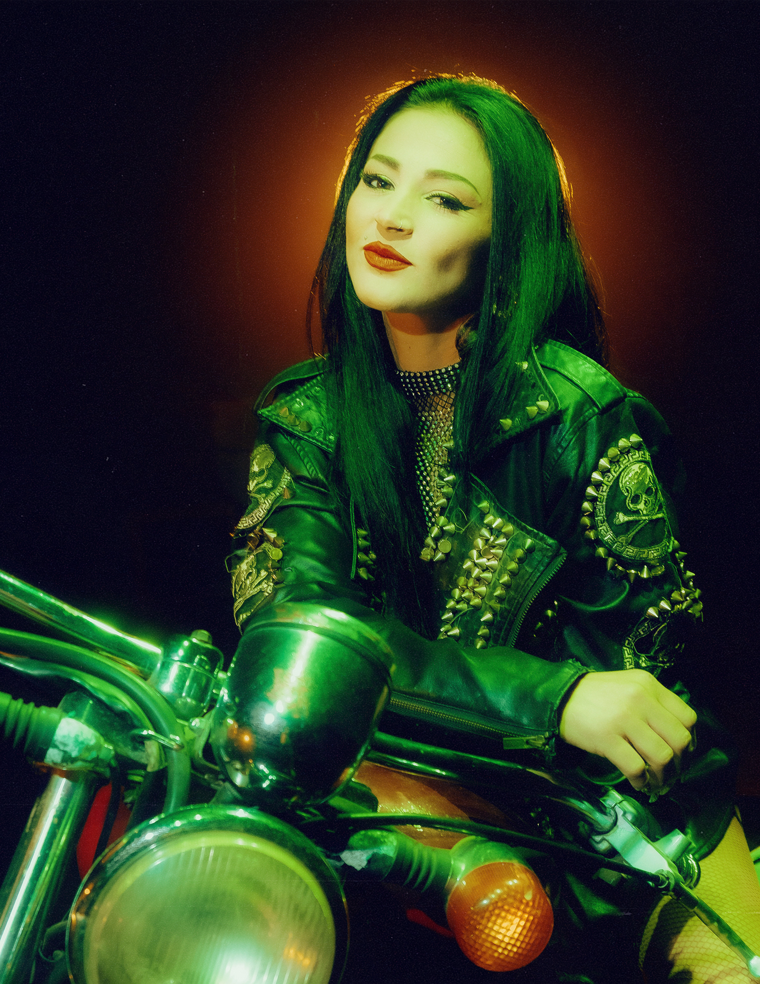 Glamorous photoshoot for a circus performer: motorcycle, fashion and dynamics