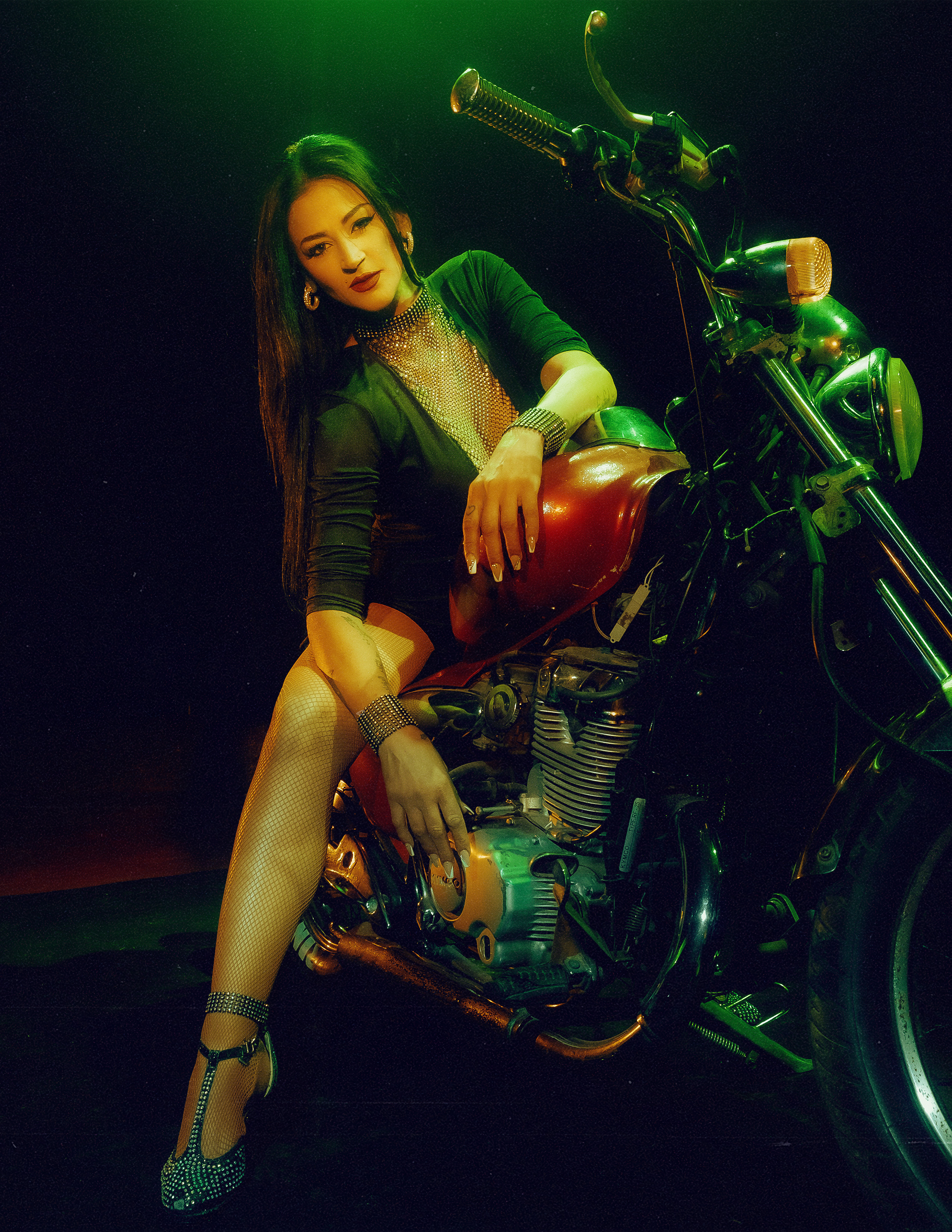 Glamorous photoshoot for a circus performer: motorcycle, fashion and dynamics