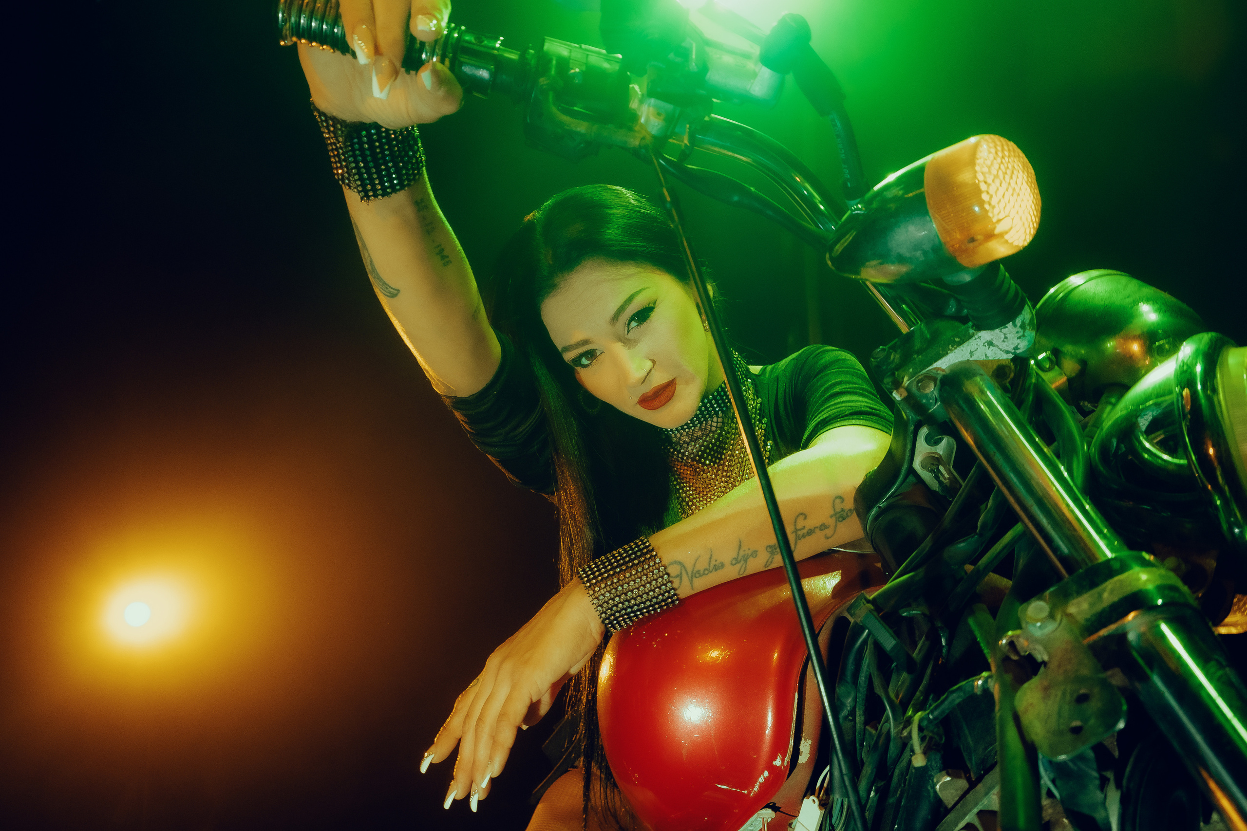 Glamorous photoshoot for a circus performer: motorcycle, fashion and dynamics