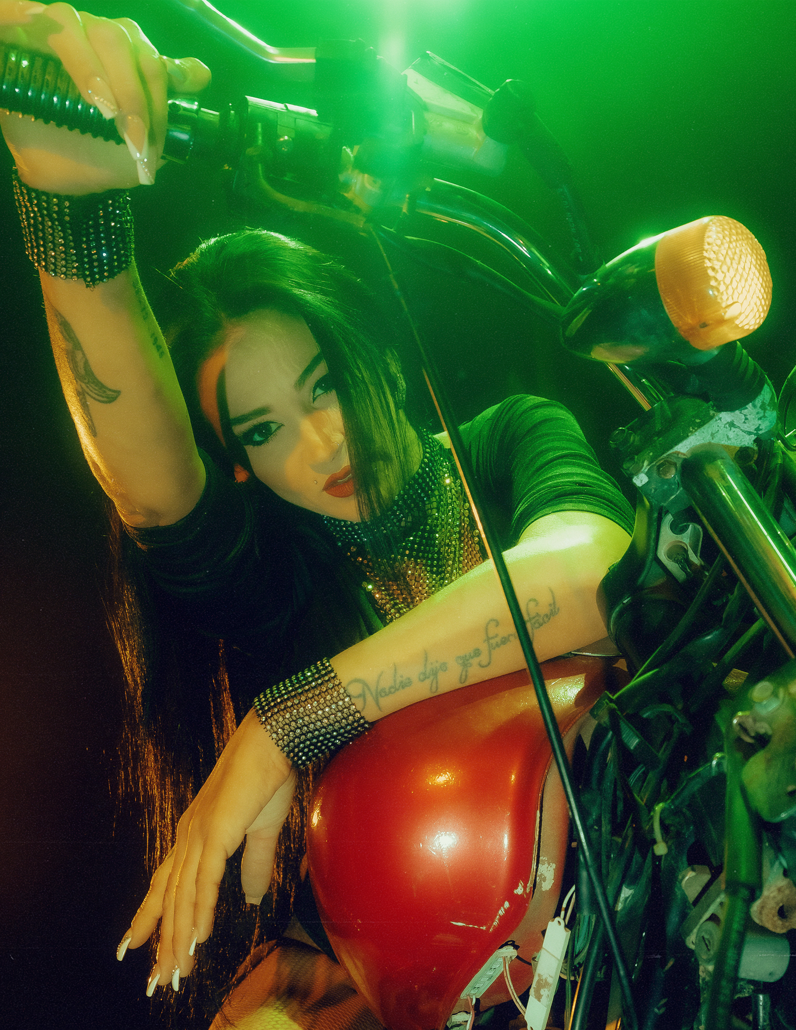 Glamorous photoshoot for a circus performer: motorcycle, fashion and dynamics