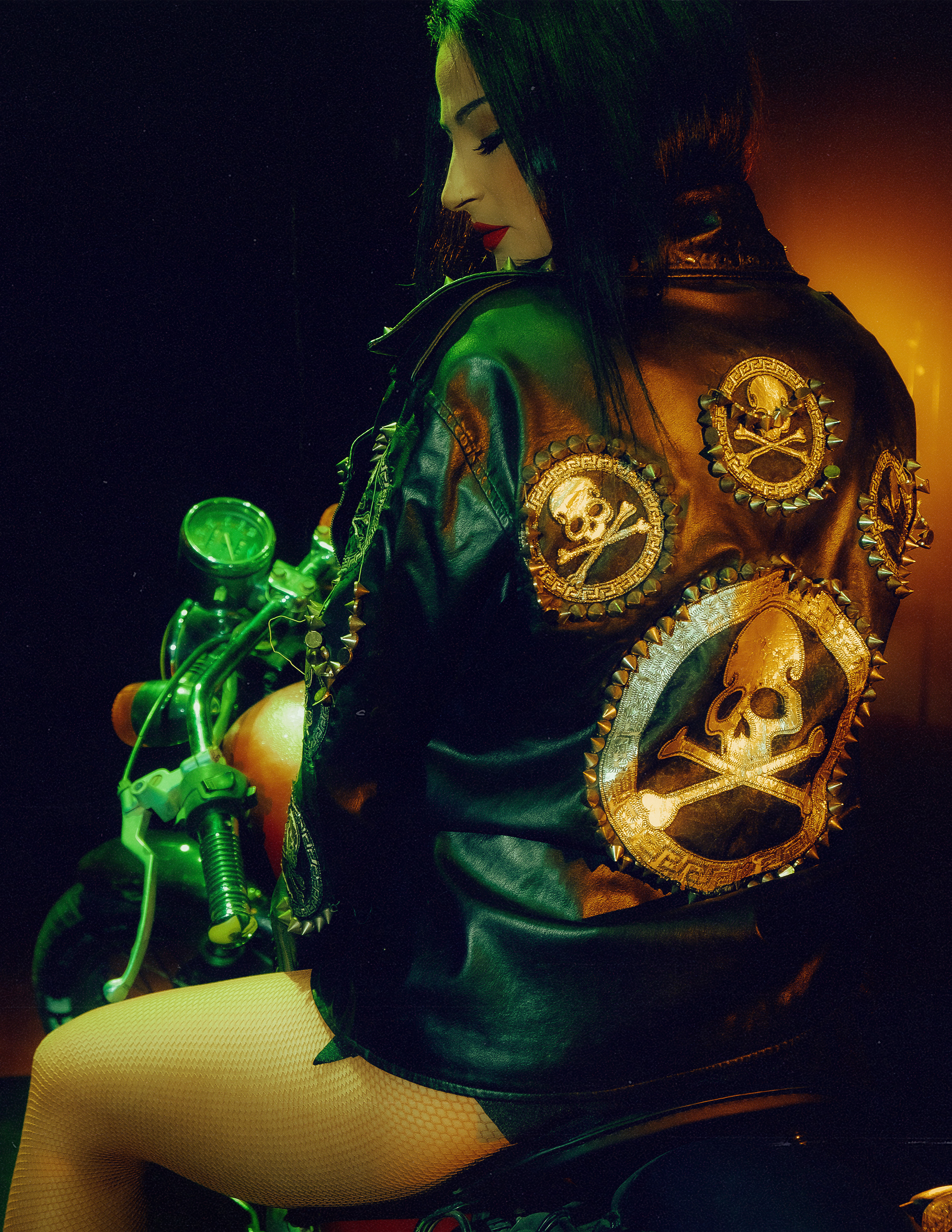 Glamorous photoshoot for a circus performer: motorcycle, fashion and dynamics