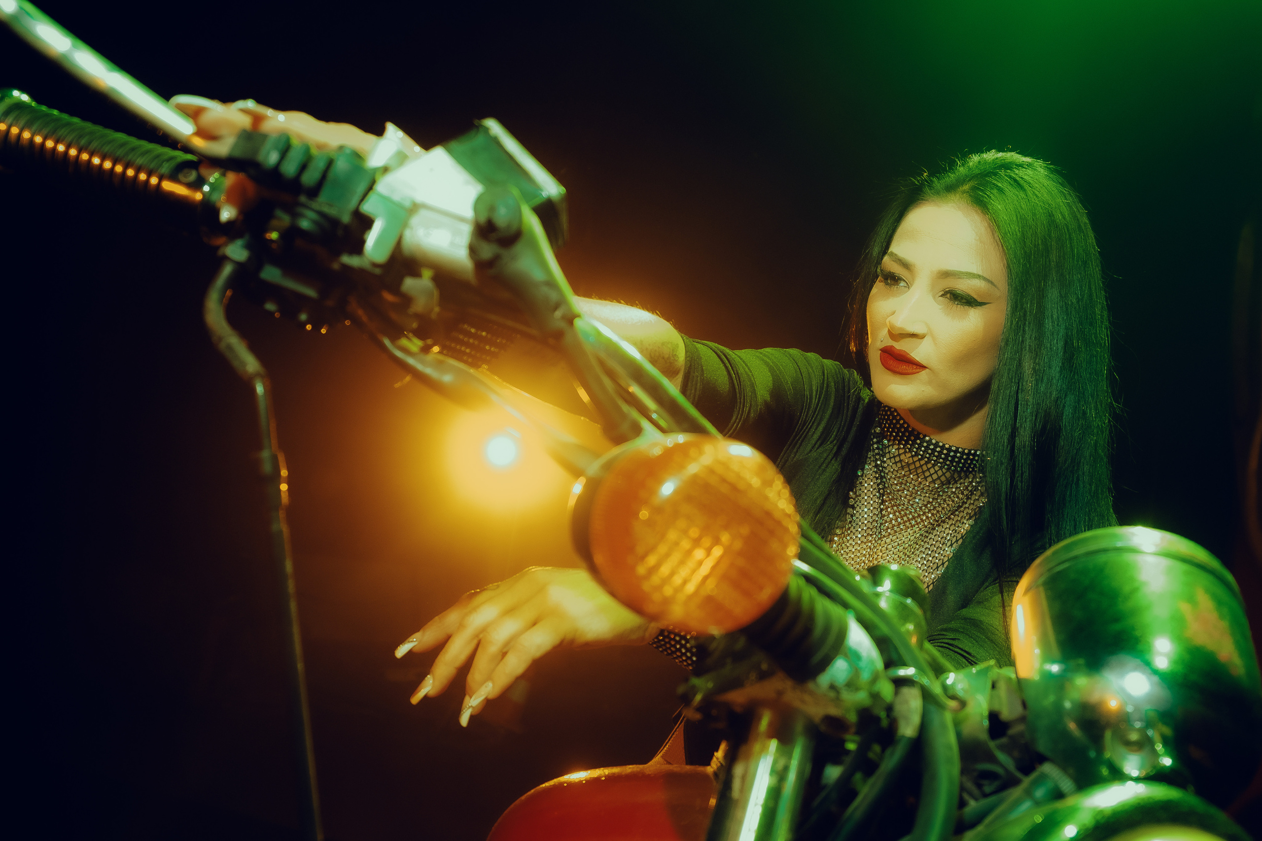 Glamorous photoshoot for a circus performer: motorcycle, fashion and dynamics