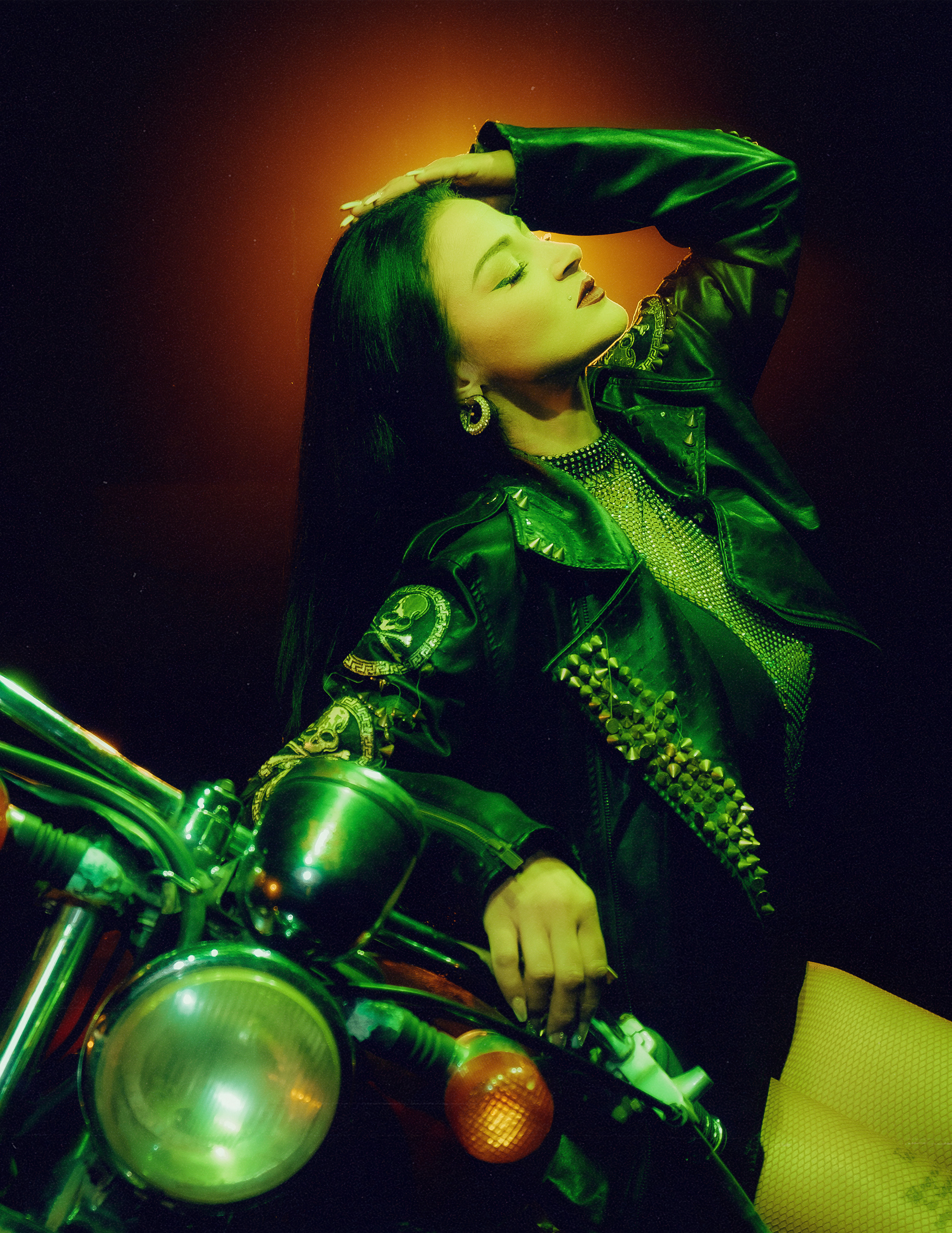 Glamorous photoshoot for a circus performer: motorcycle, fashion and dynamics