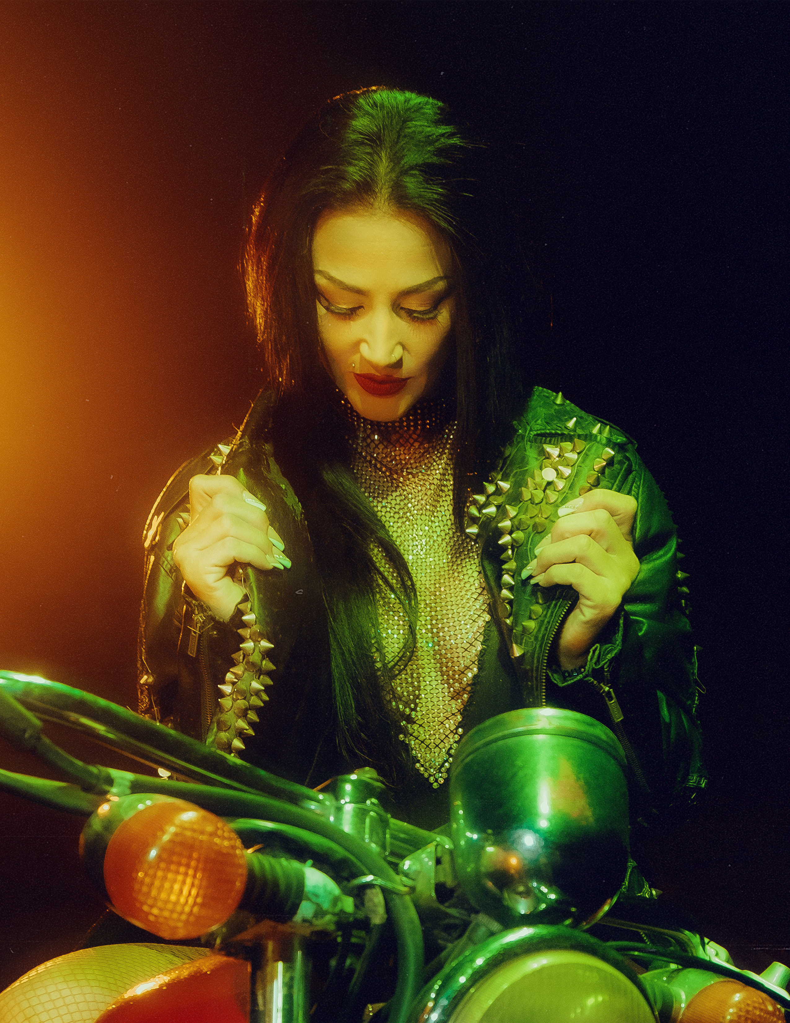 Glamorous photoshoot for a circus performer: motorcycle, fashion and dynamics