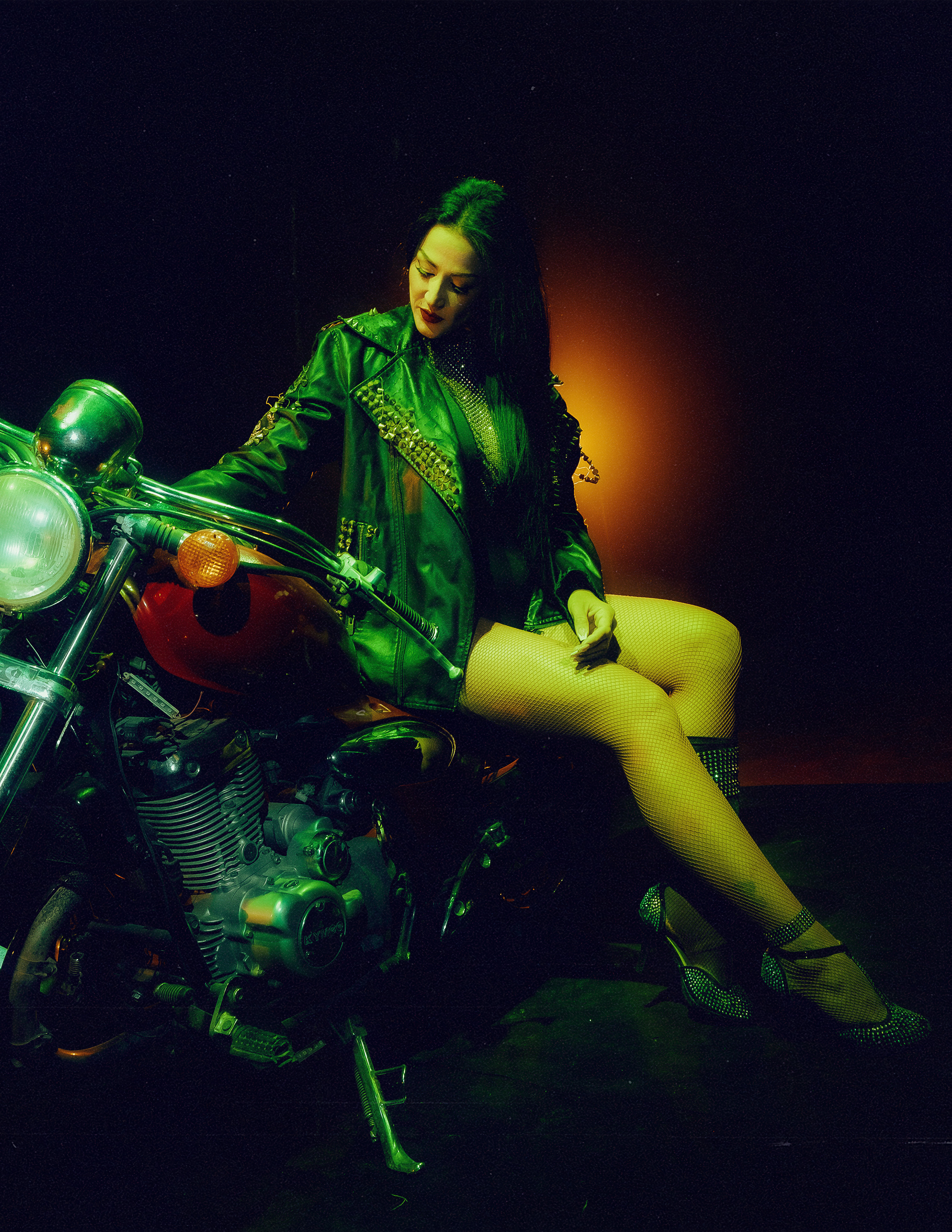 Glamorous photoshoot for a circus performer: motorcycle, fashion and dynamics