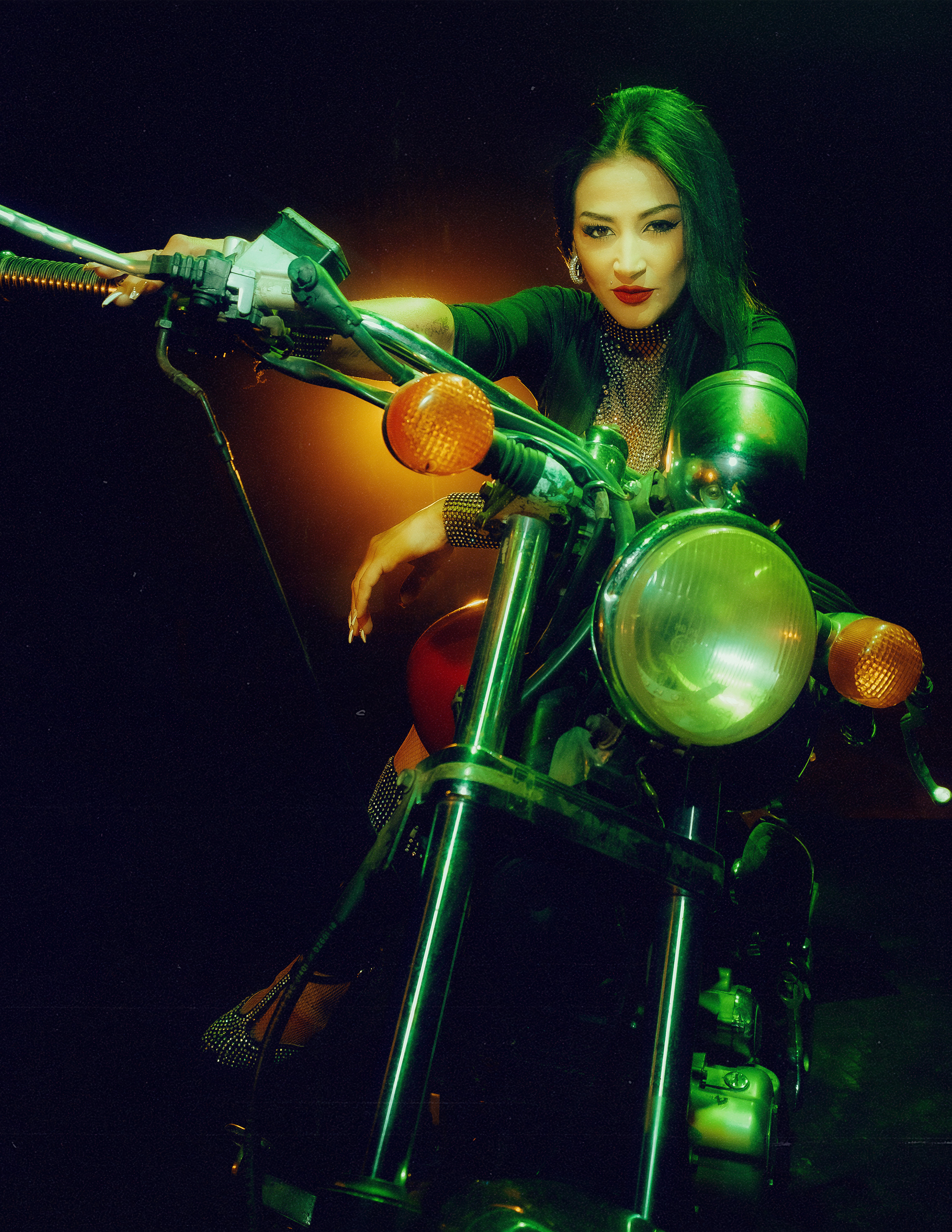 Glamorous photoshoot for a circus performer: motorcycle, fashion and dynamics