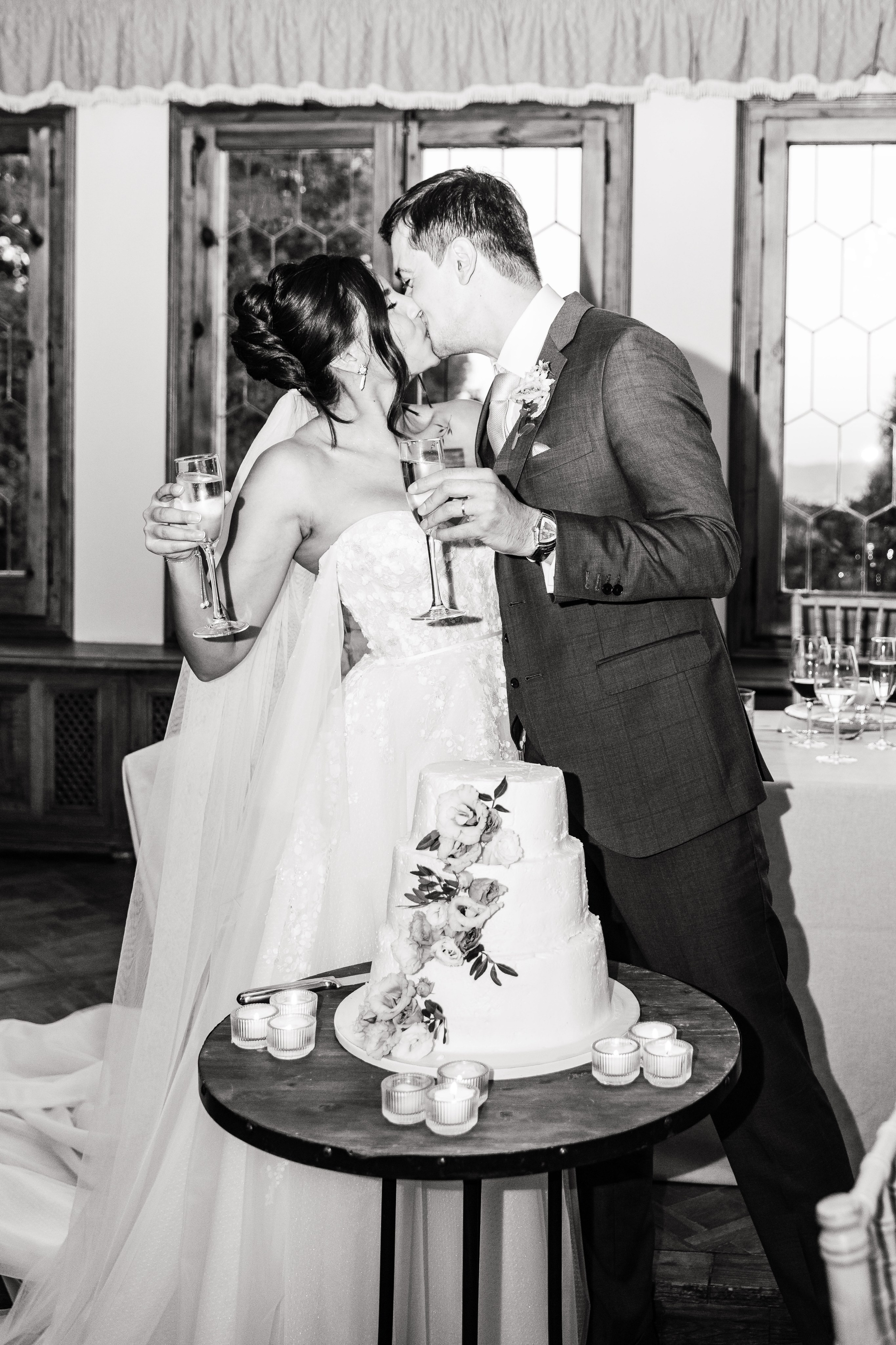 Bride and groom sharing a kiss at sunset