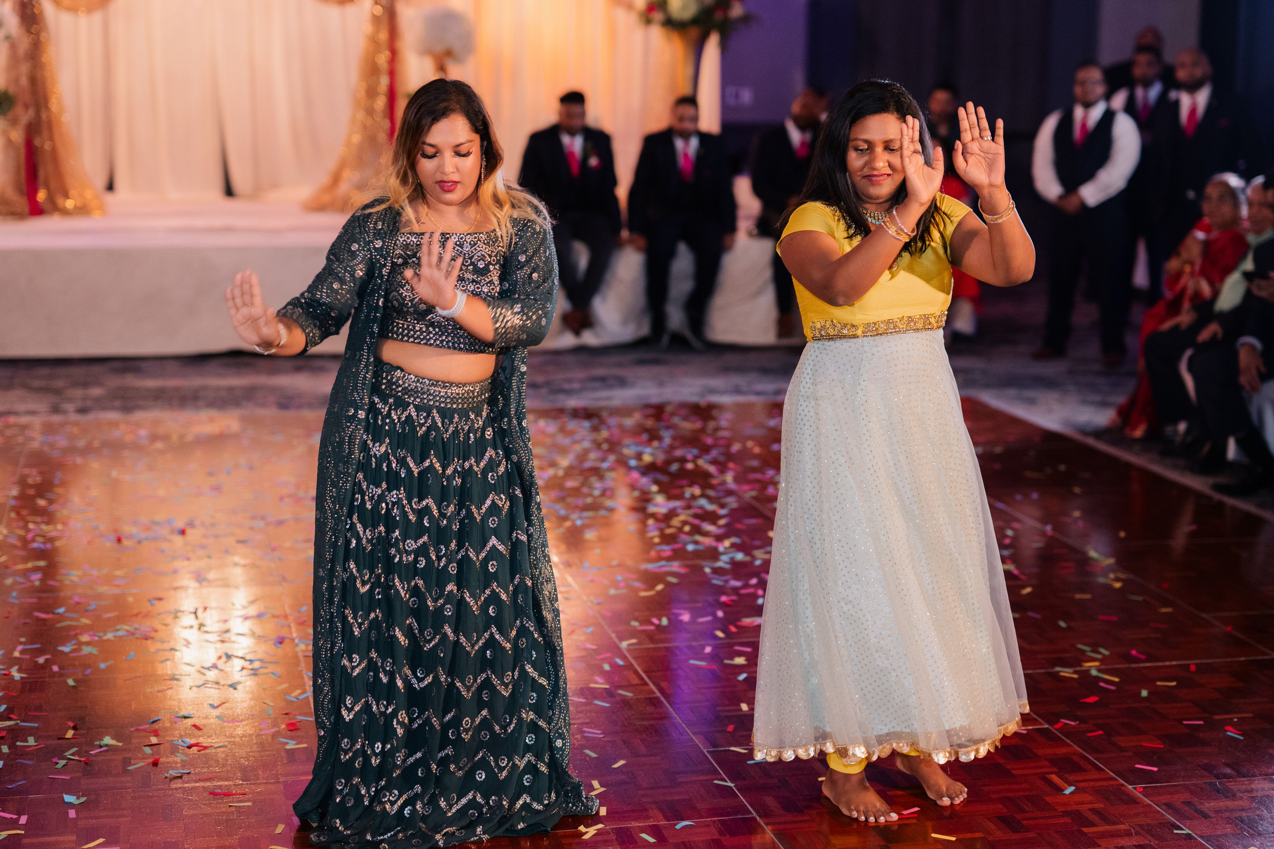 two women are dancing on a dance floor