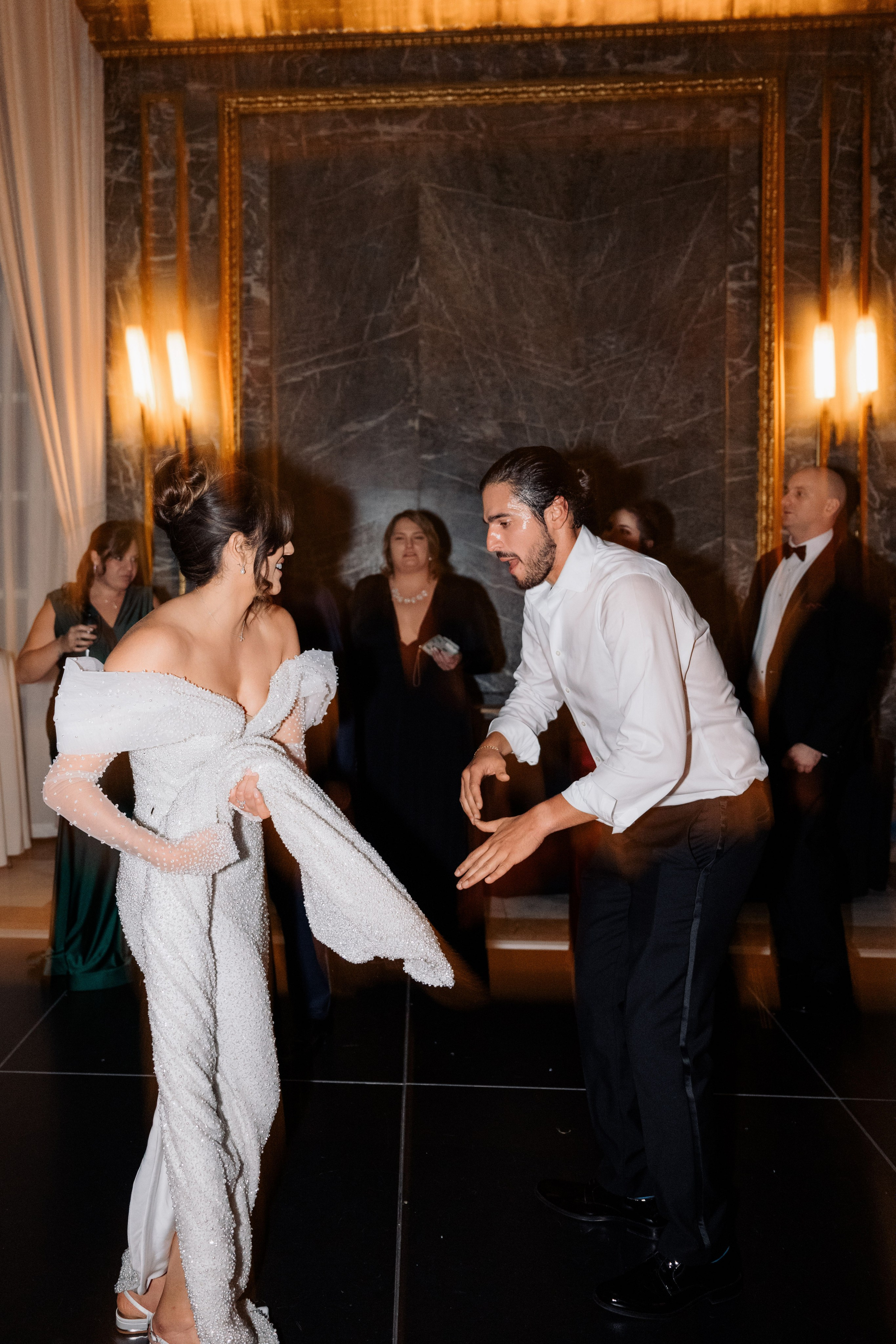 a man and woman dancing on a dance floor