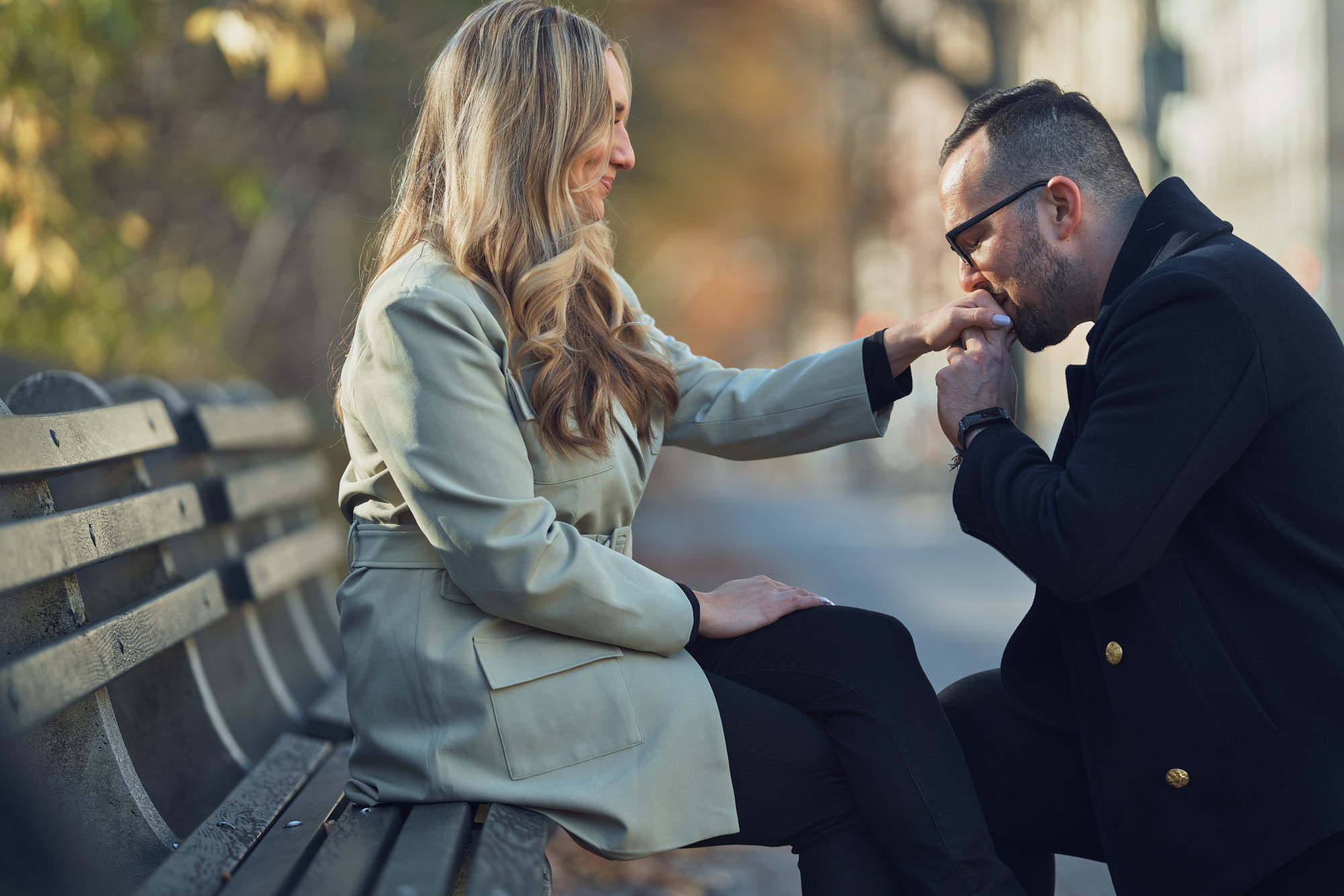 Romantic surprise proposal in Central Park captured by photographer Alex Pedan. Groom-to-be on one knee proposing to his partner.