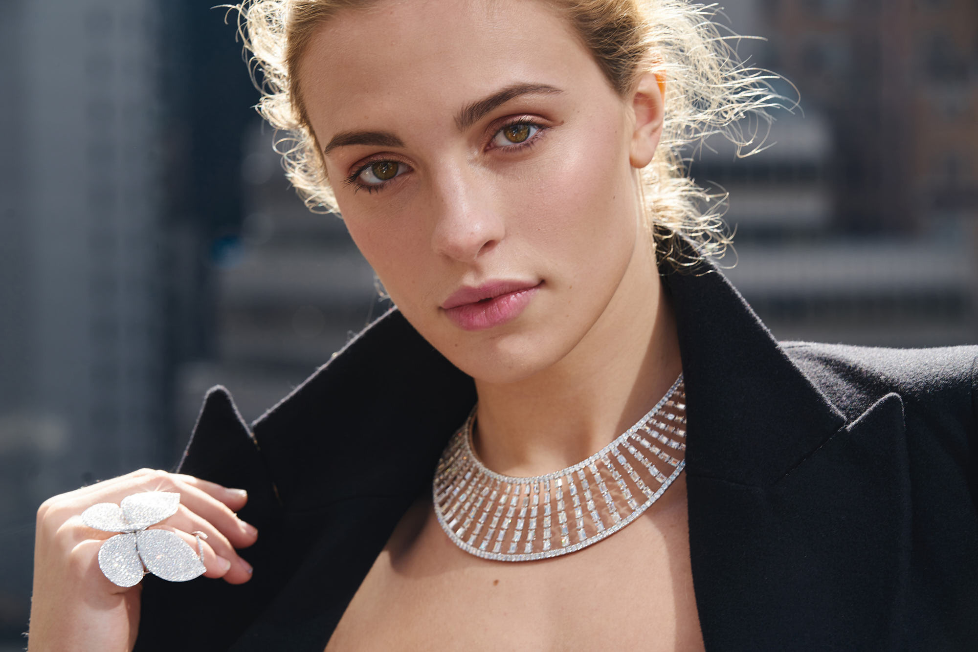 Close-up beauty portrait of the stunning Eva Werheim wearing a butterfly diamond ring and necklace. This exquisite jewelry shot is perfect for advertising purposes.