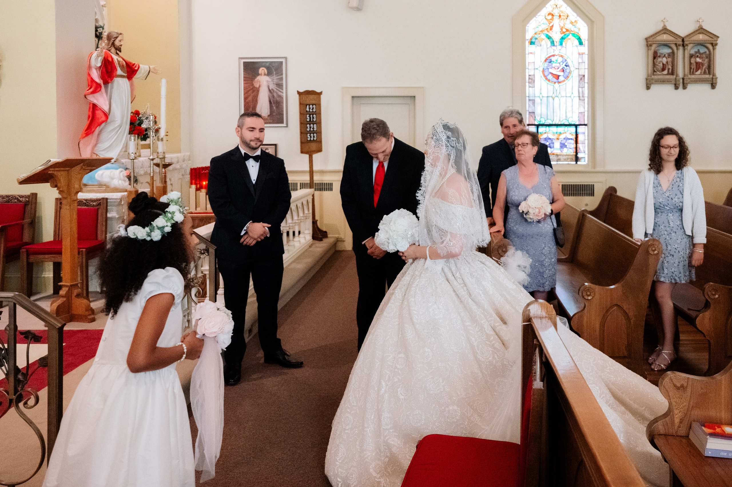 a bride and groom walking down the aisle