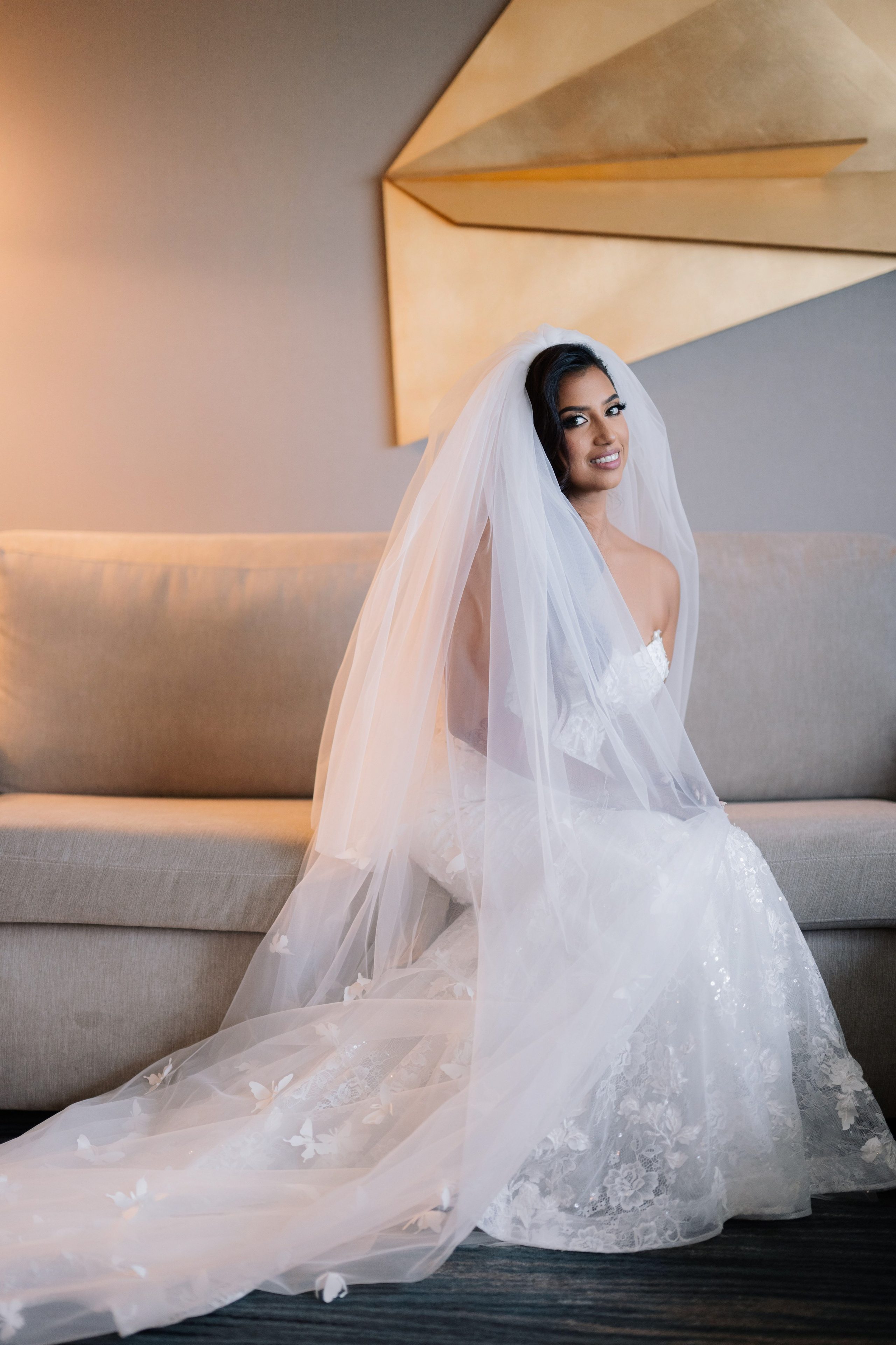 a bride sitting on a couch in a room