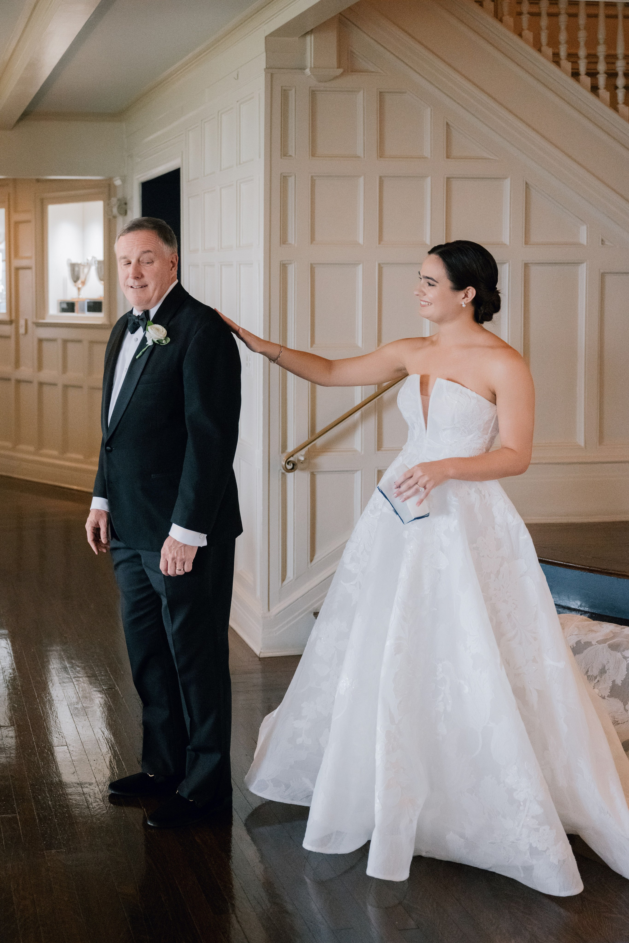a bride and groom standing in a room