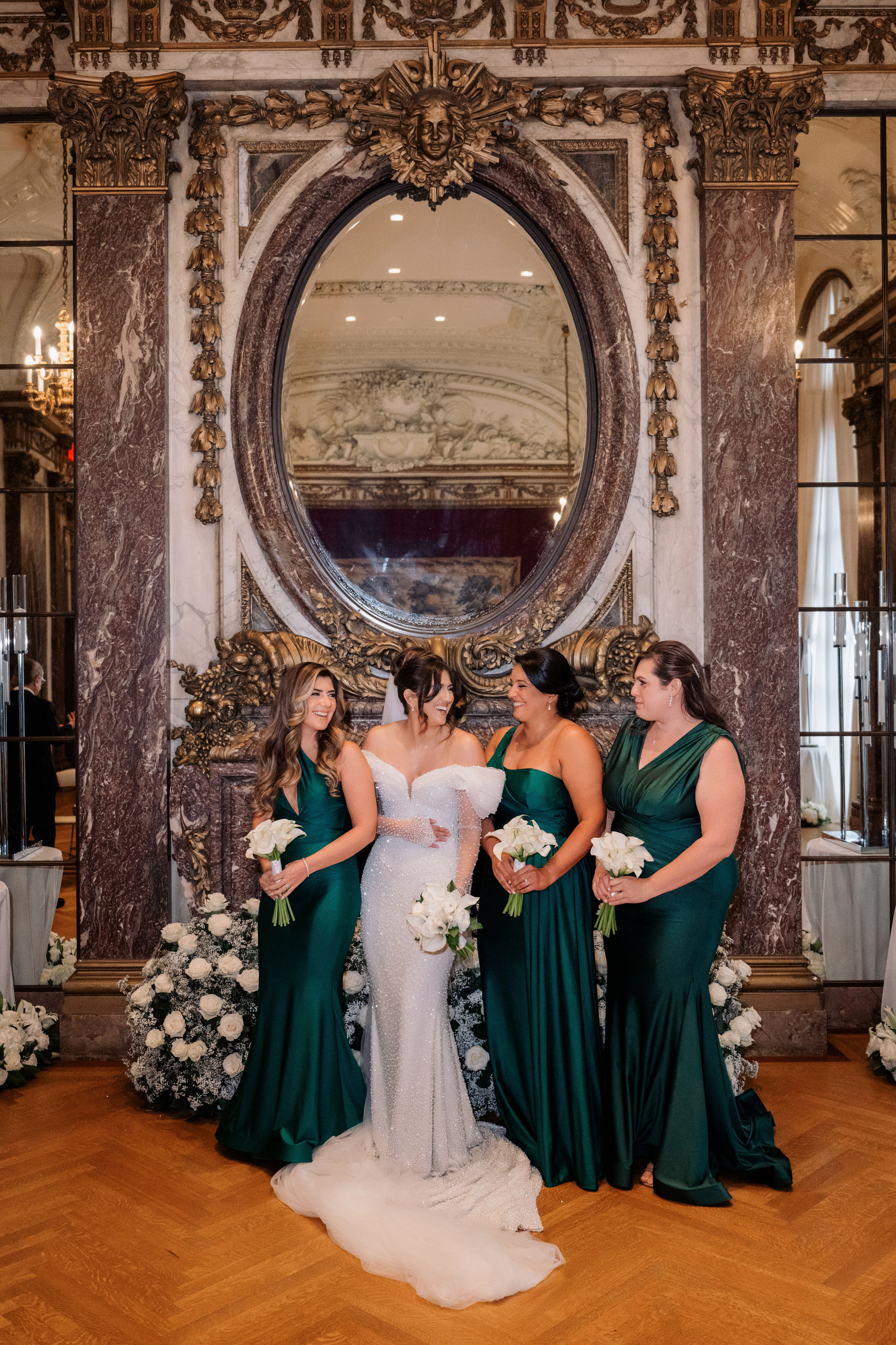a bride and her bridesmaids in a room