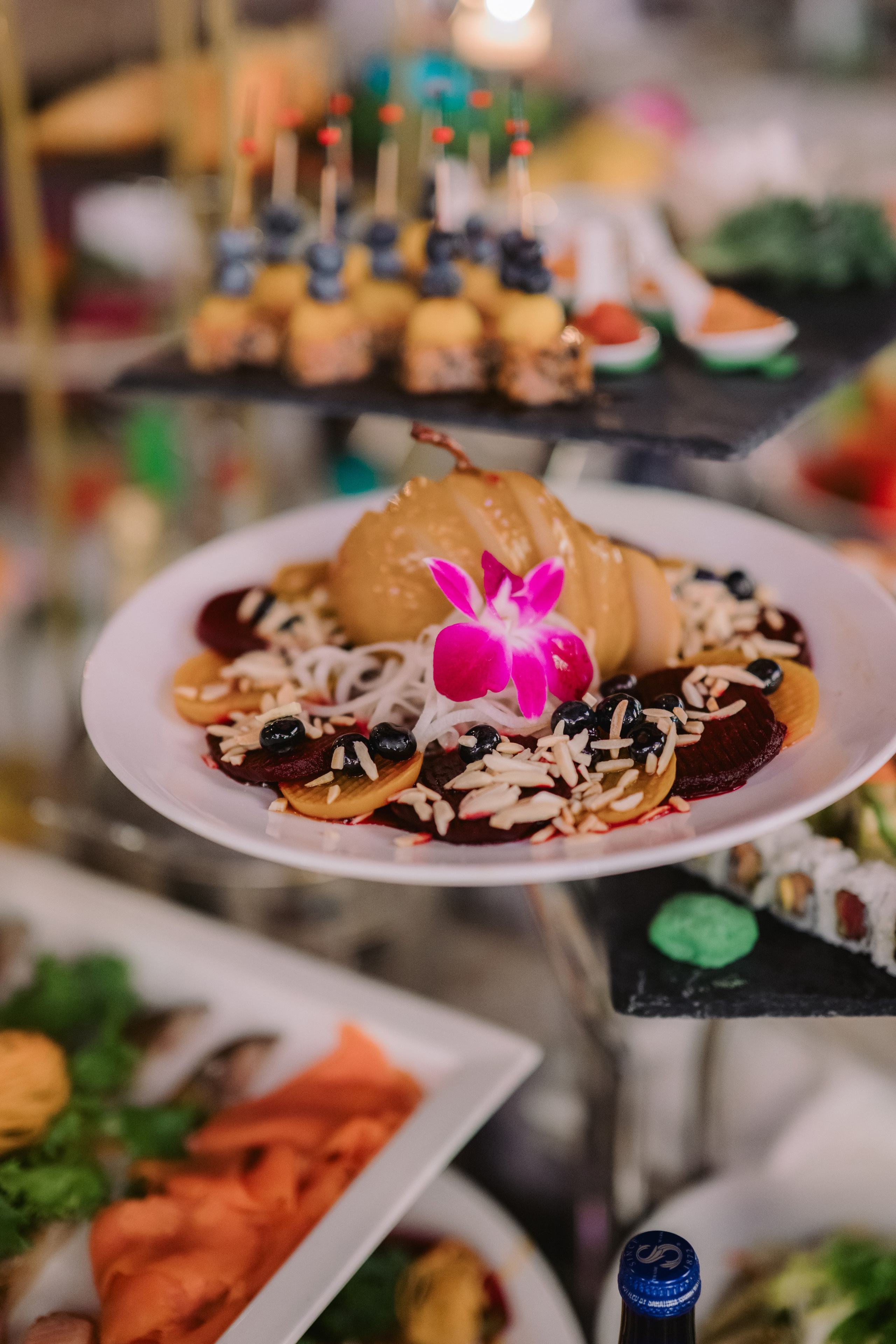 a plate of food on a table with a candle