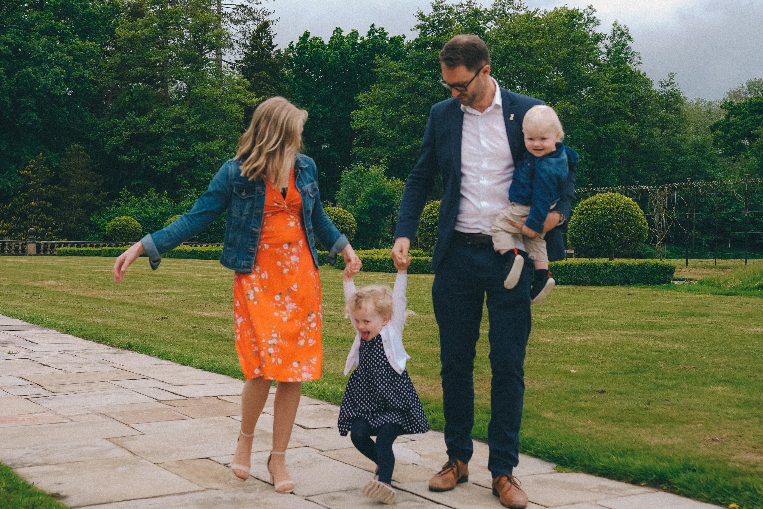 Family photo session in Solihull. Family is happy walking in Hogarths hotel