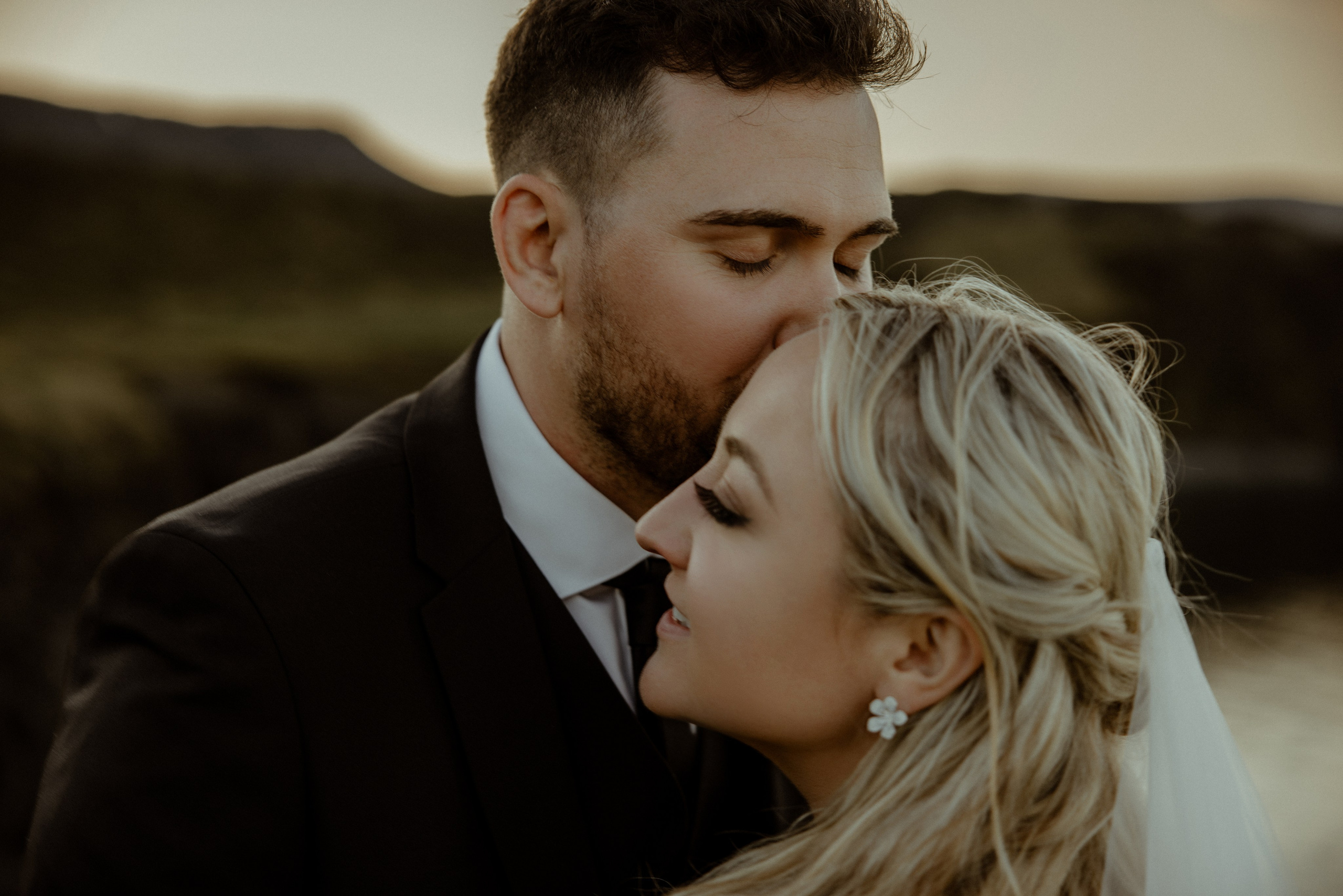 Iceland elopement at Budir with midnight sun wedding photos at black sand beach. Iceland elopement photographer & videographer