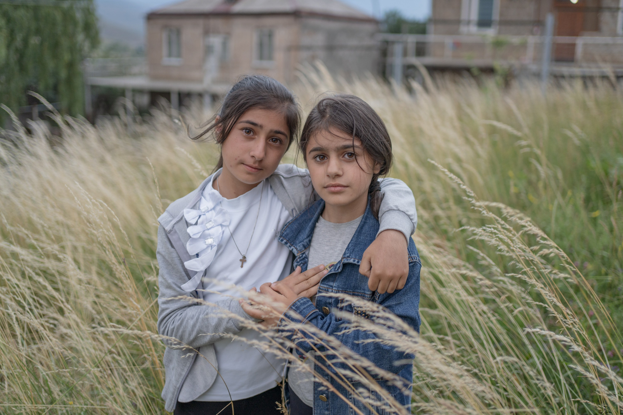 Children of Ttujur, Armenia are posing in front of the camera during the last day of their summer camp.