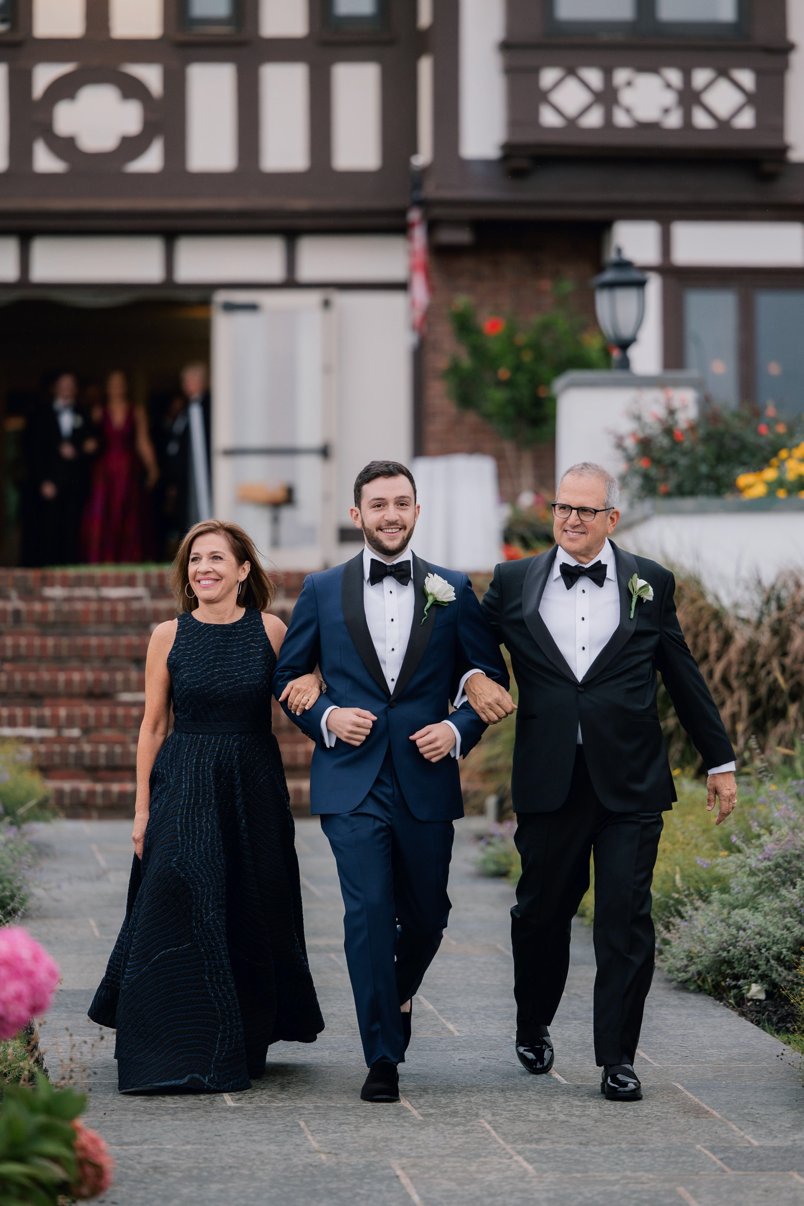 a man and woman walking down a sidewalk