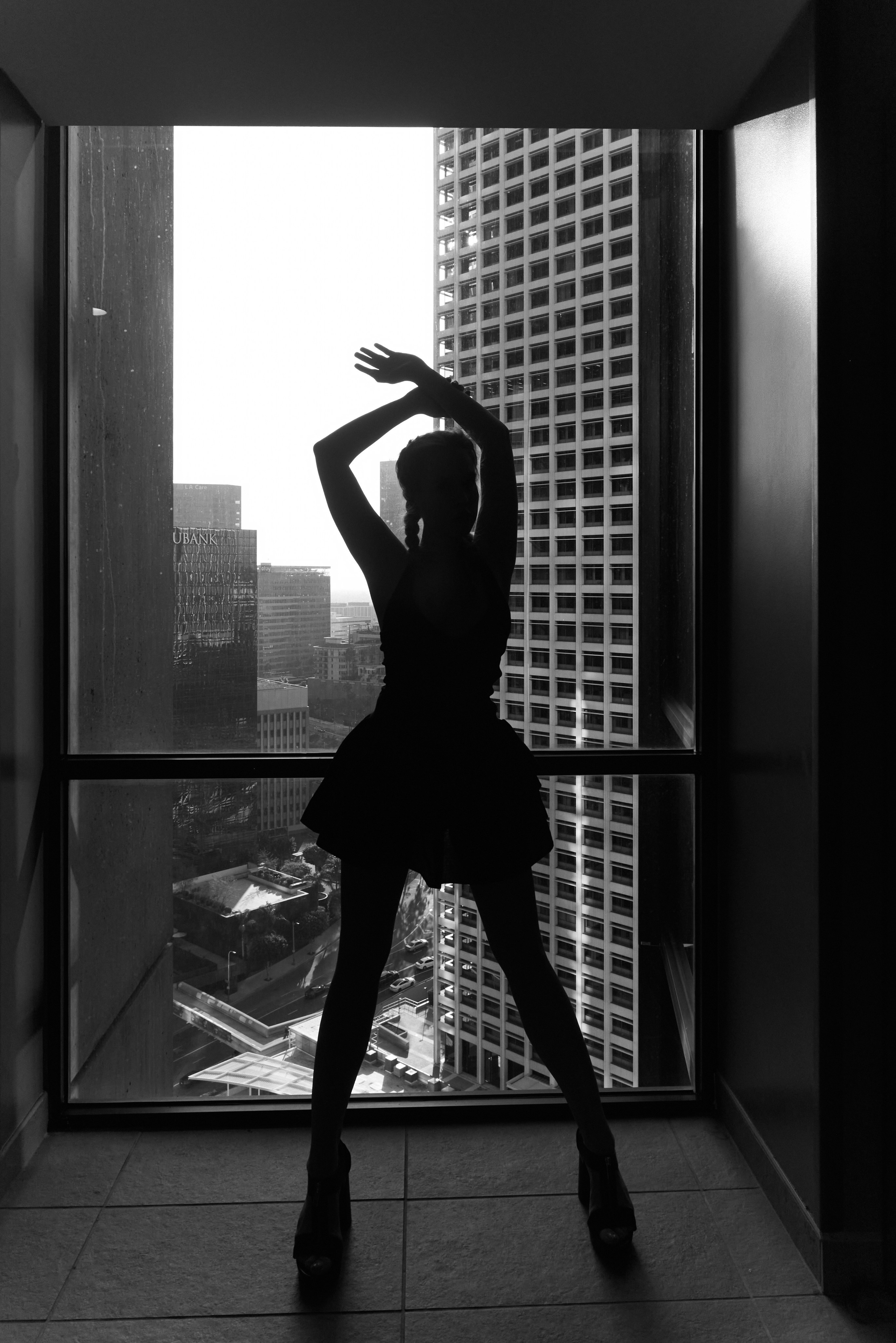 Black and white silhouette portrait with city view