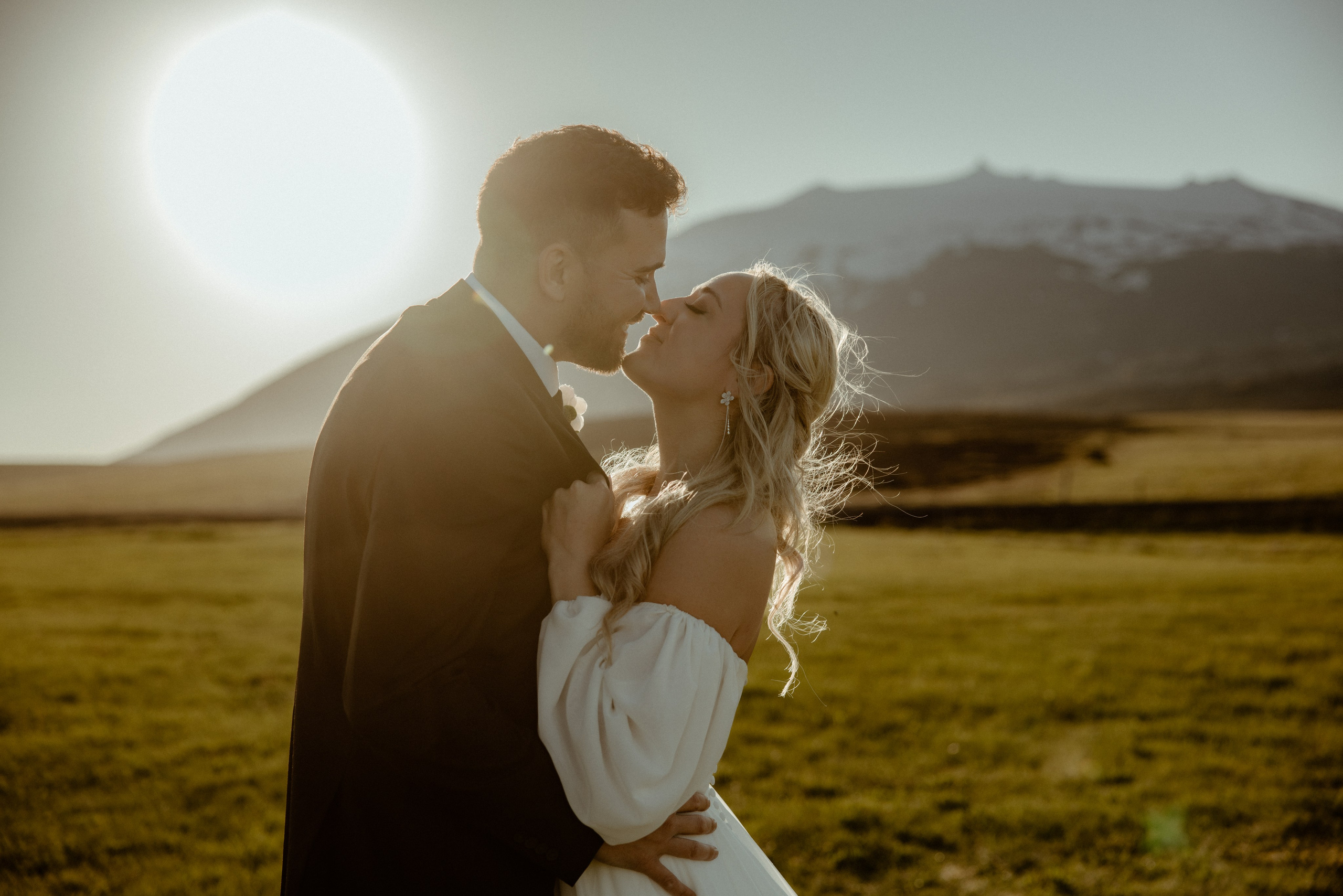 Iceland elopement at Budir with midnight sun wedding photos at black sand beach. Iceland elopement photographer & videographer