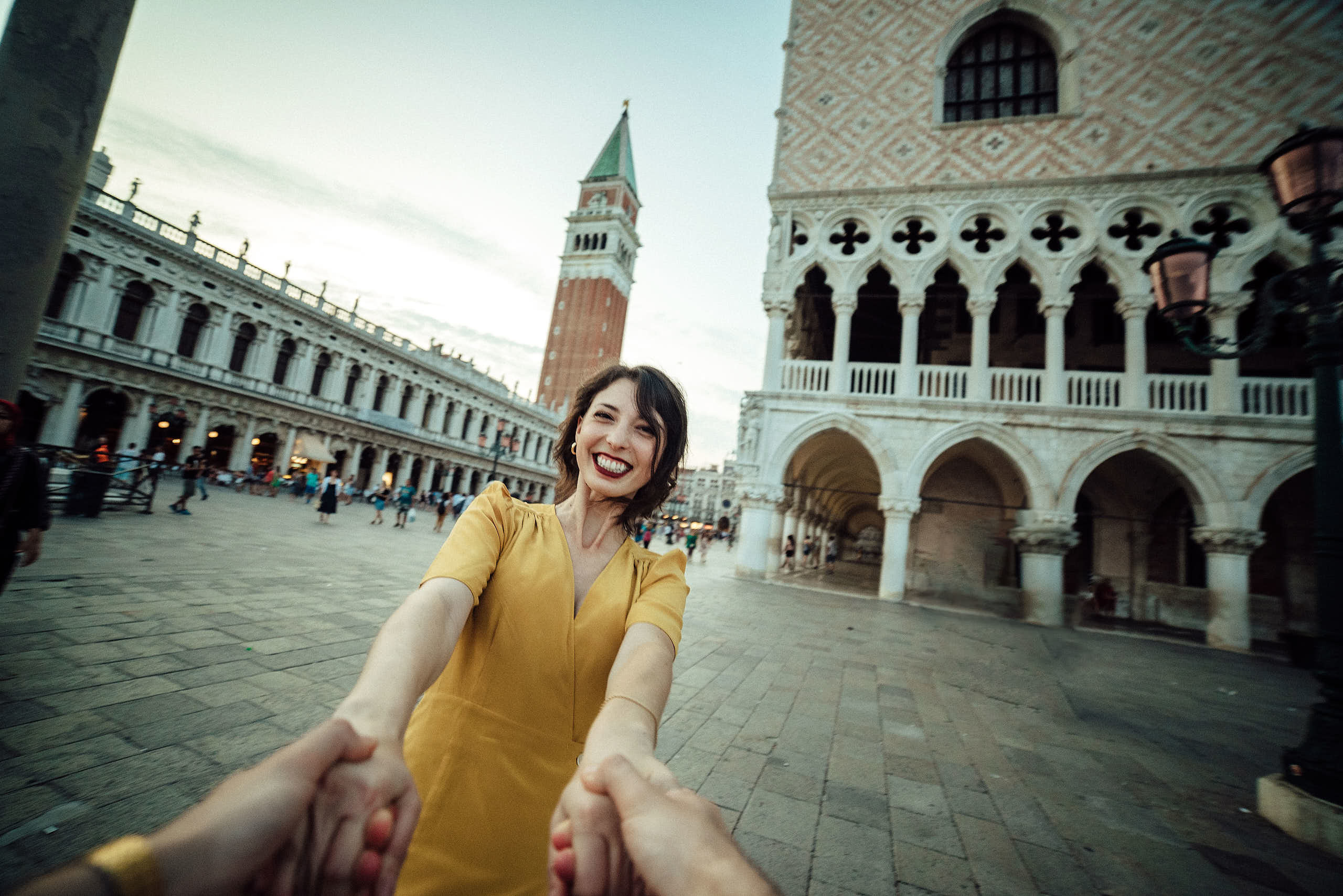 dynamic natural photo of young lady near san Marco square
