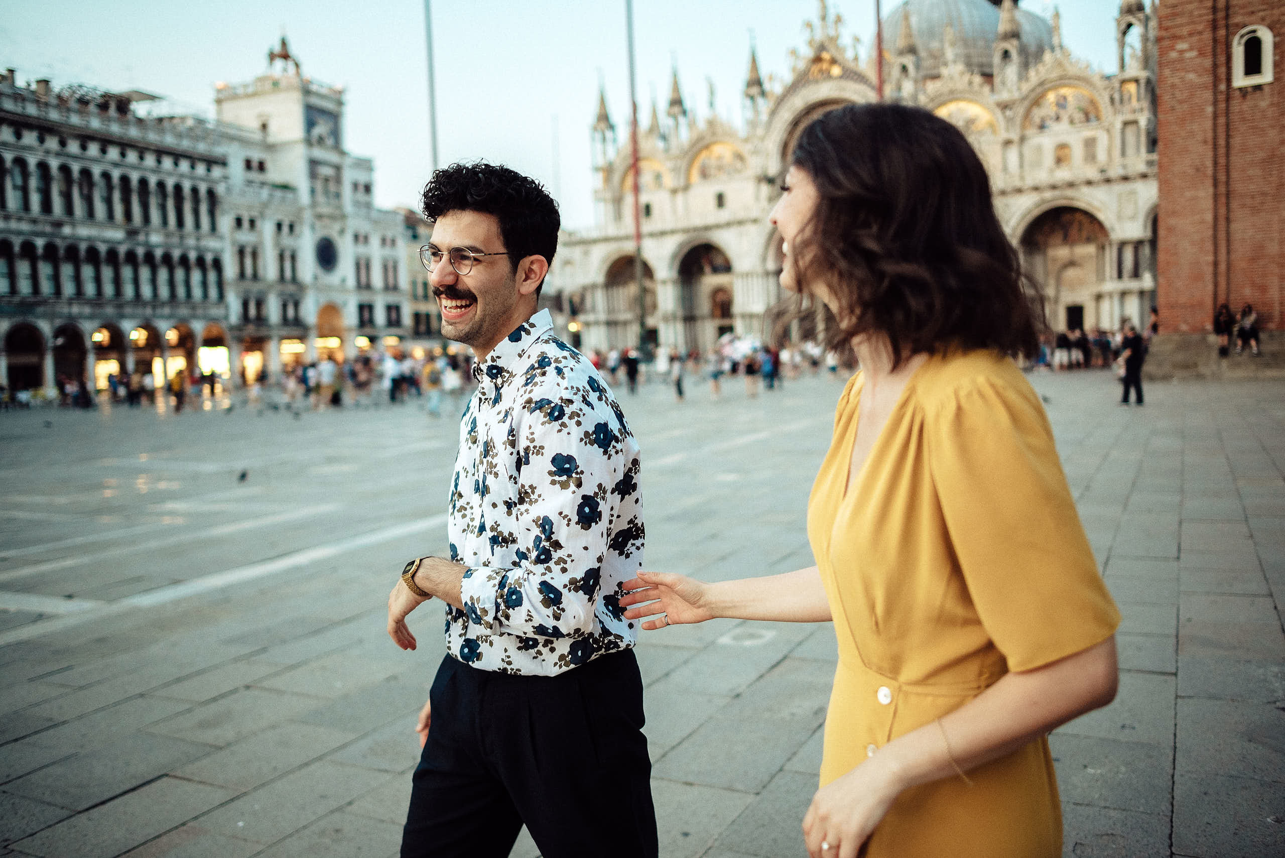 guy laughing with her girlfriend on san Marco square